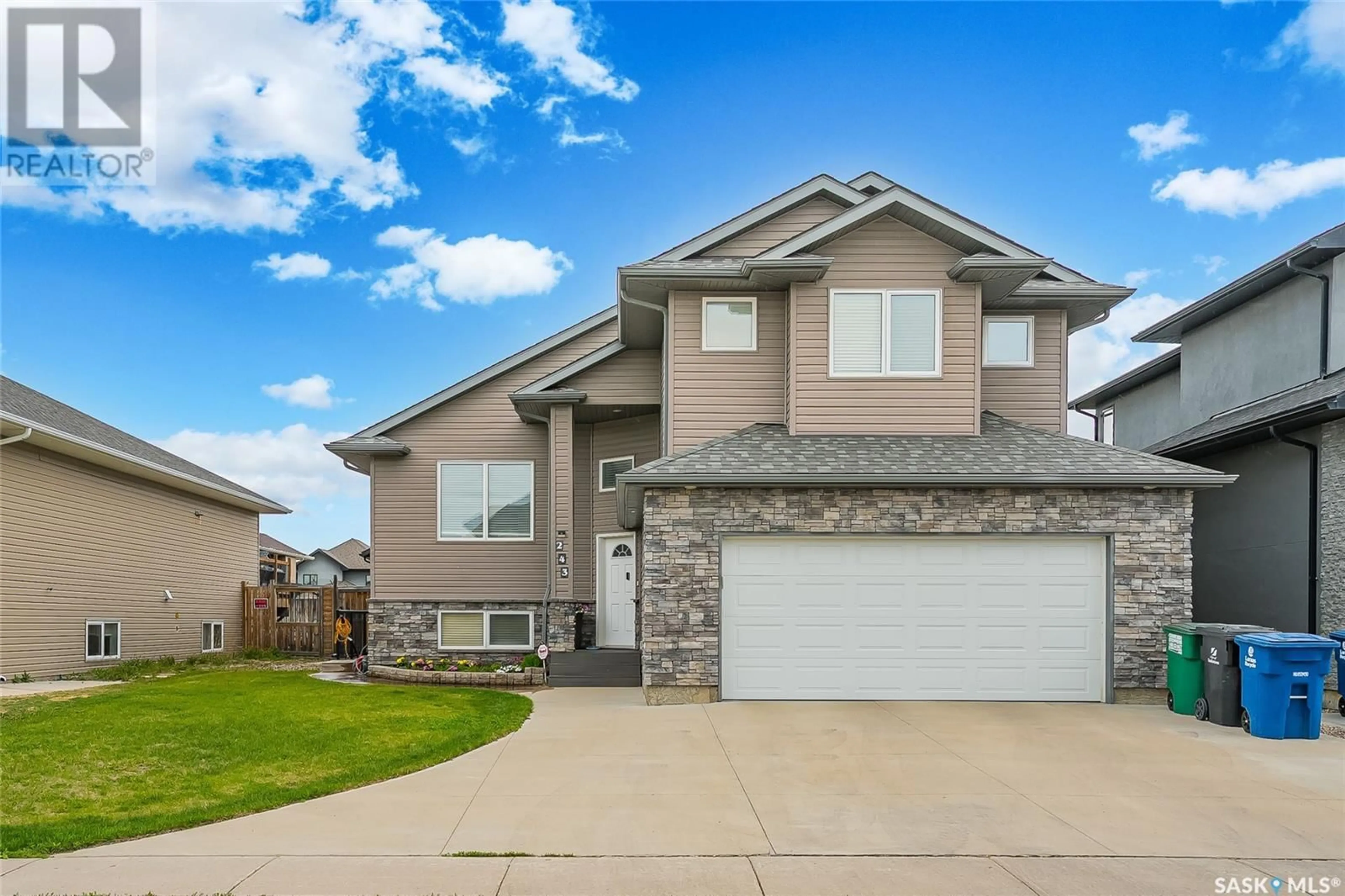 Home with vinyl exterior material, street for 243 WERSCHNER CRESCENT, Saskatoon Saskatchewan S7V0E1