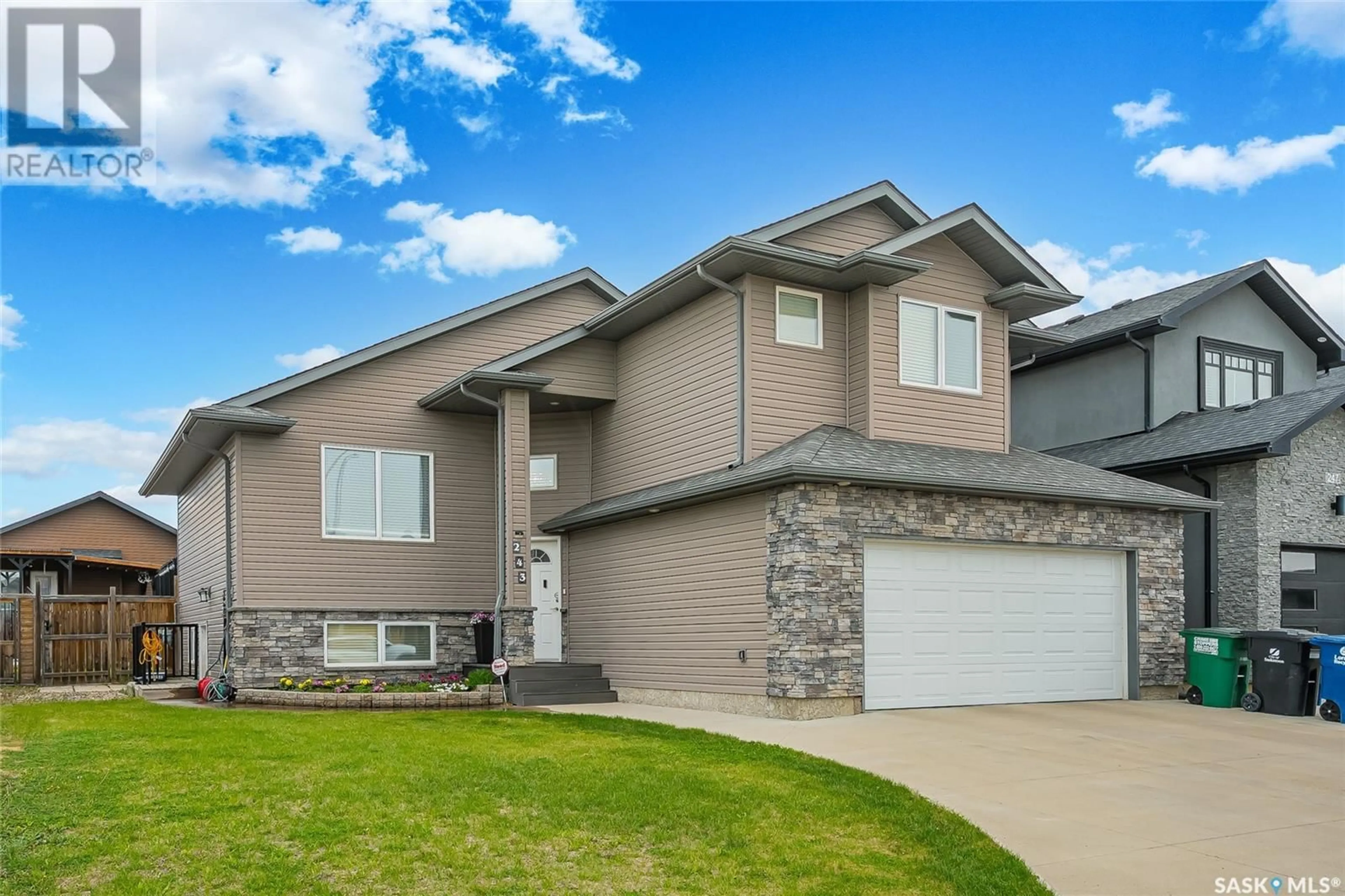 Home with vinyl exterior material, street for 243 WERSCHNER CRESCENT, Saskatoon Saskatchewan S7V0E1