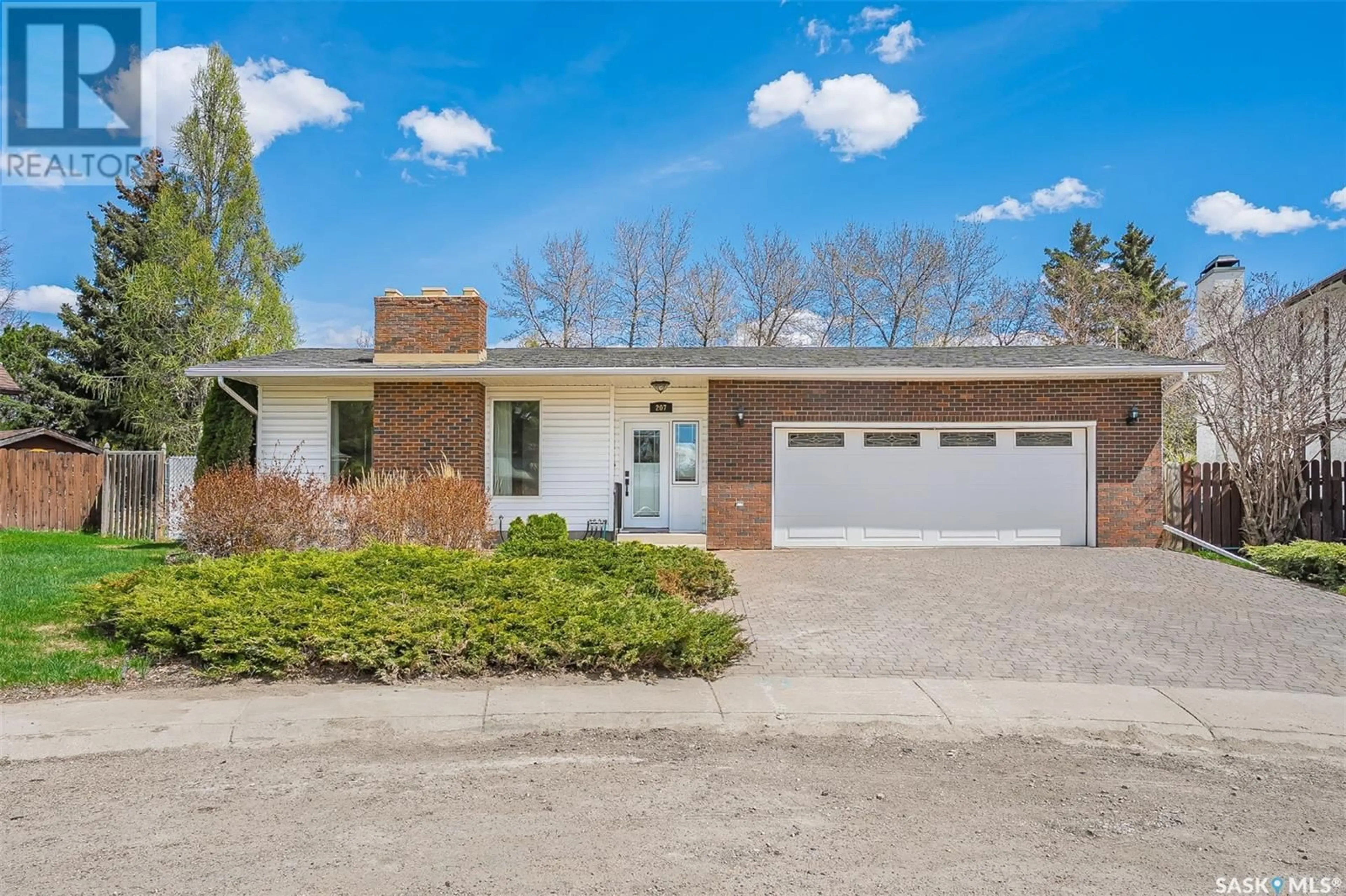 Home with brick exterior material, street for 207 COSTIGAN BAY, Saskatoon Saskatchewan S7J3P4