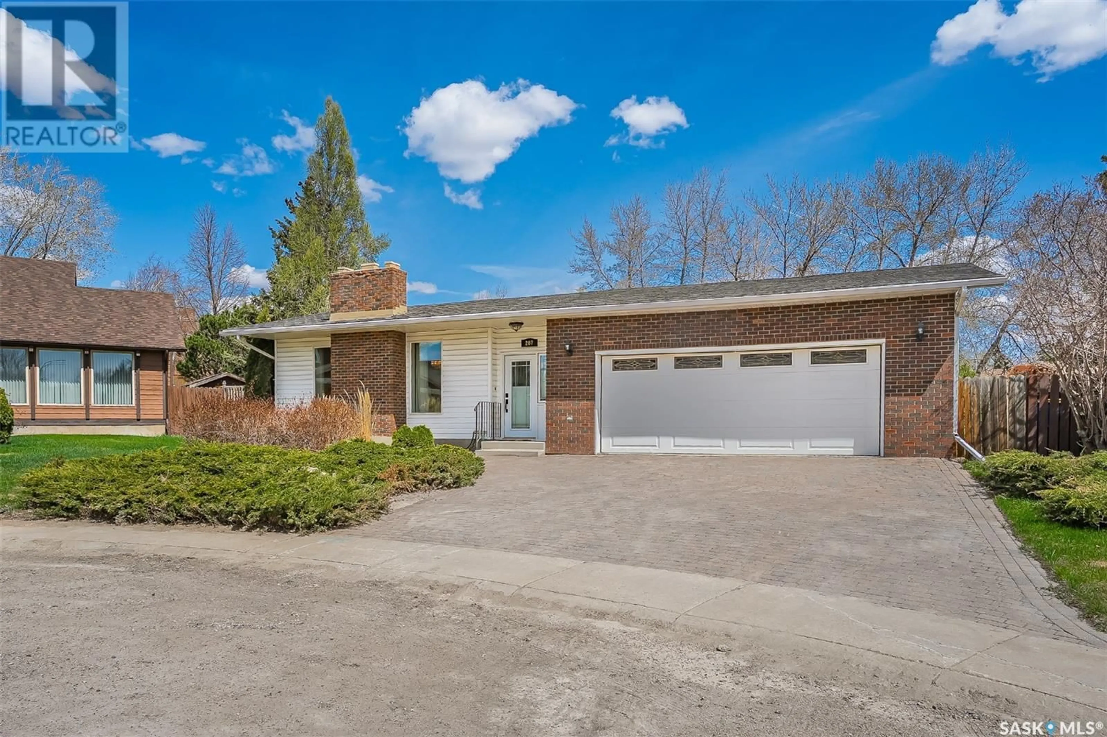 Home with brick exterior material, street for 207 COSTIGAN BAY, Saskatoon Saskatchewan S7J3P4