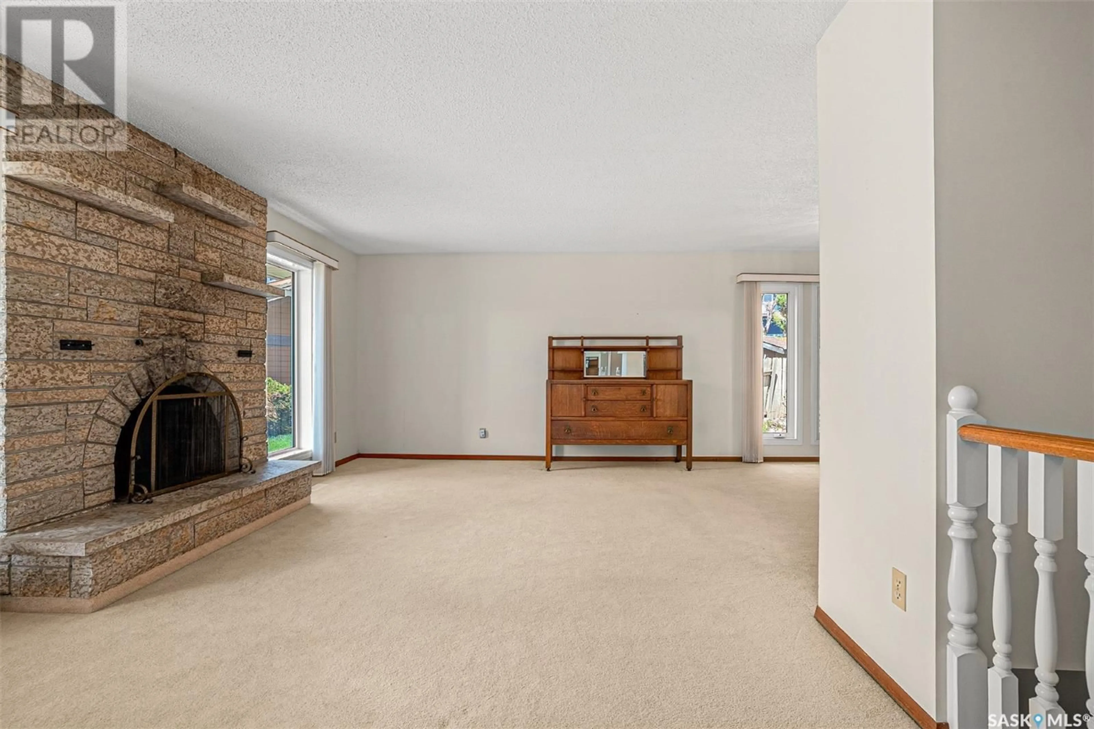 Living room with furniture, unknown for 207 COSTIGAN BAY, Saskatoon Saskatchewan S7J3P4