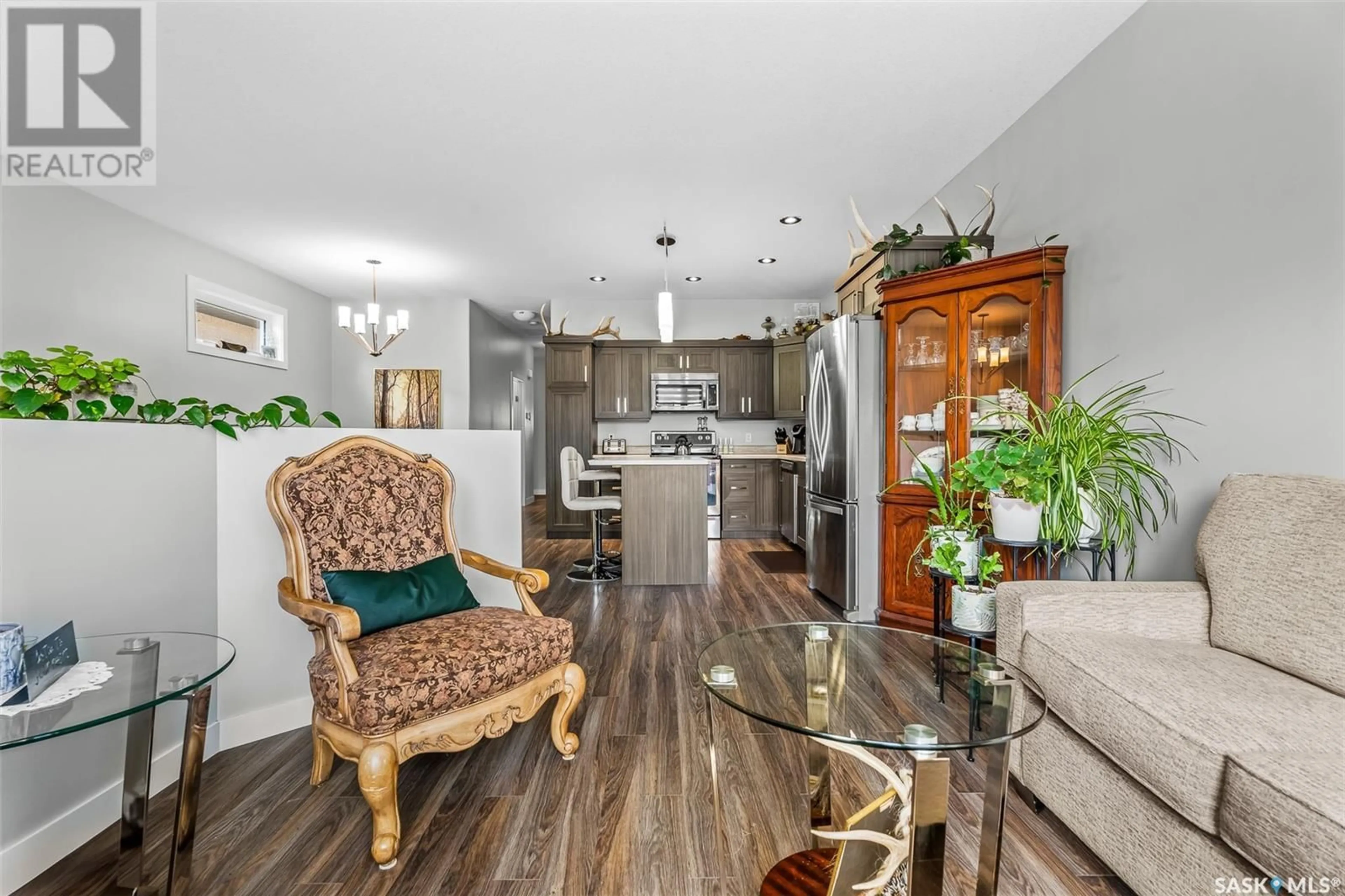 Open concept kitchen, wood/laminate floor for 72 BRIGHAM ROAD, Moose Jaw Saskatchewan S6K0A7
