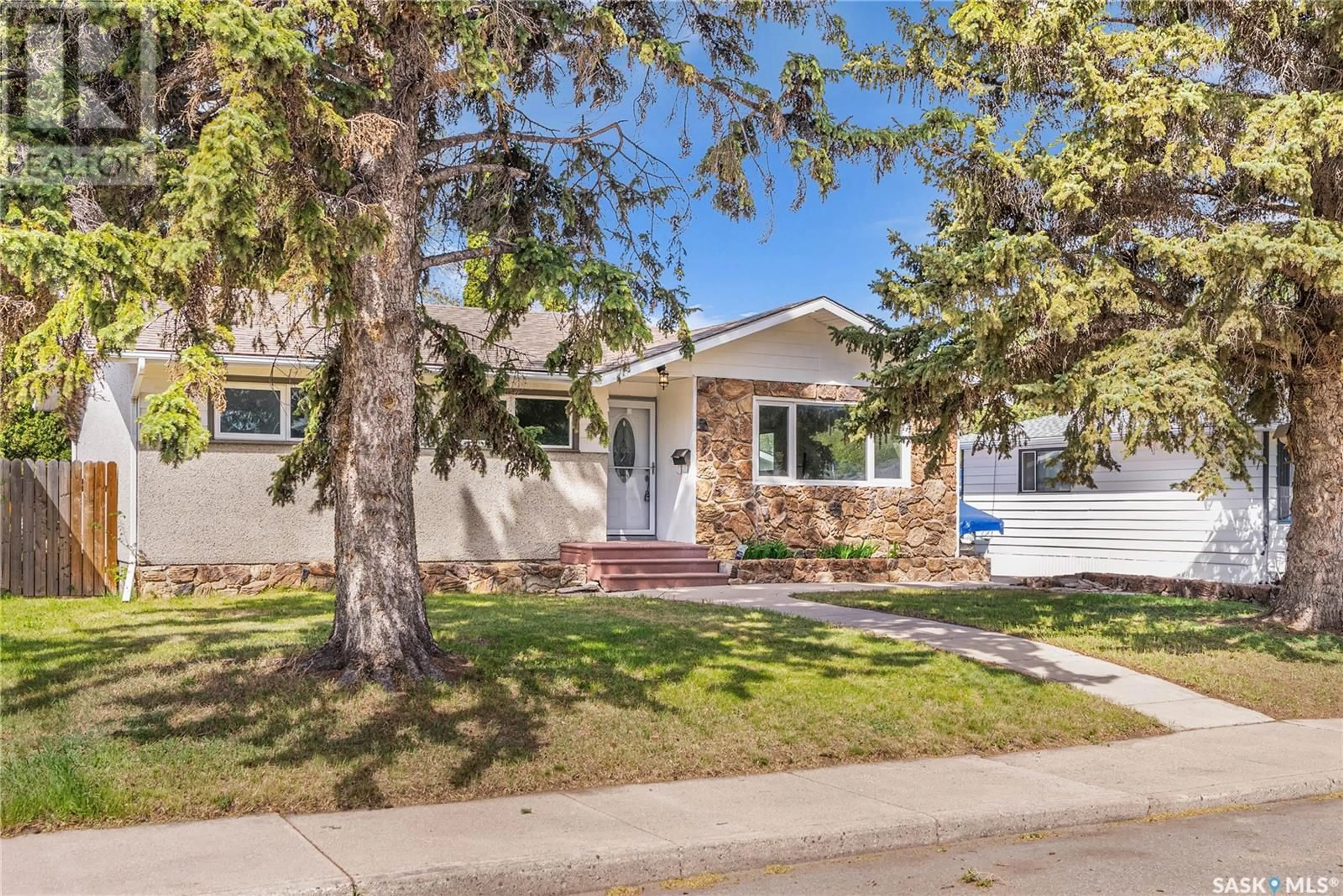 Home with vinyl exterior material, street for 329 Y AVENUE, Saskatoon Saskatchewan S7L3K8