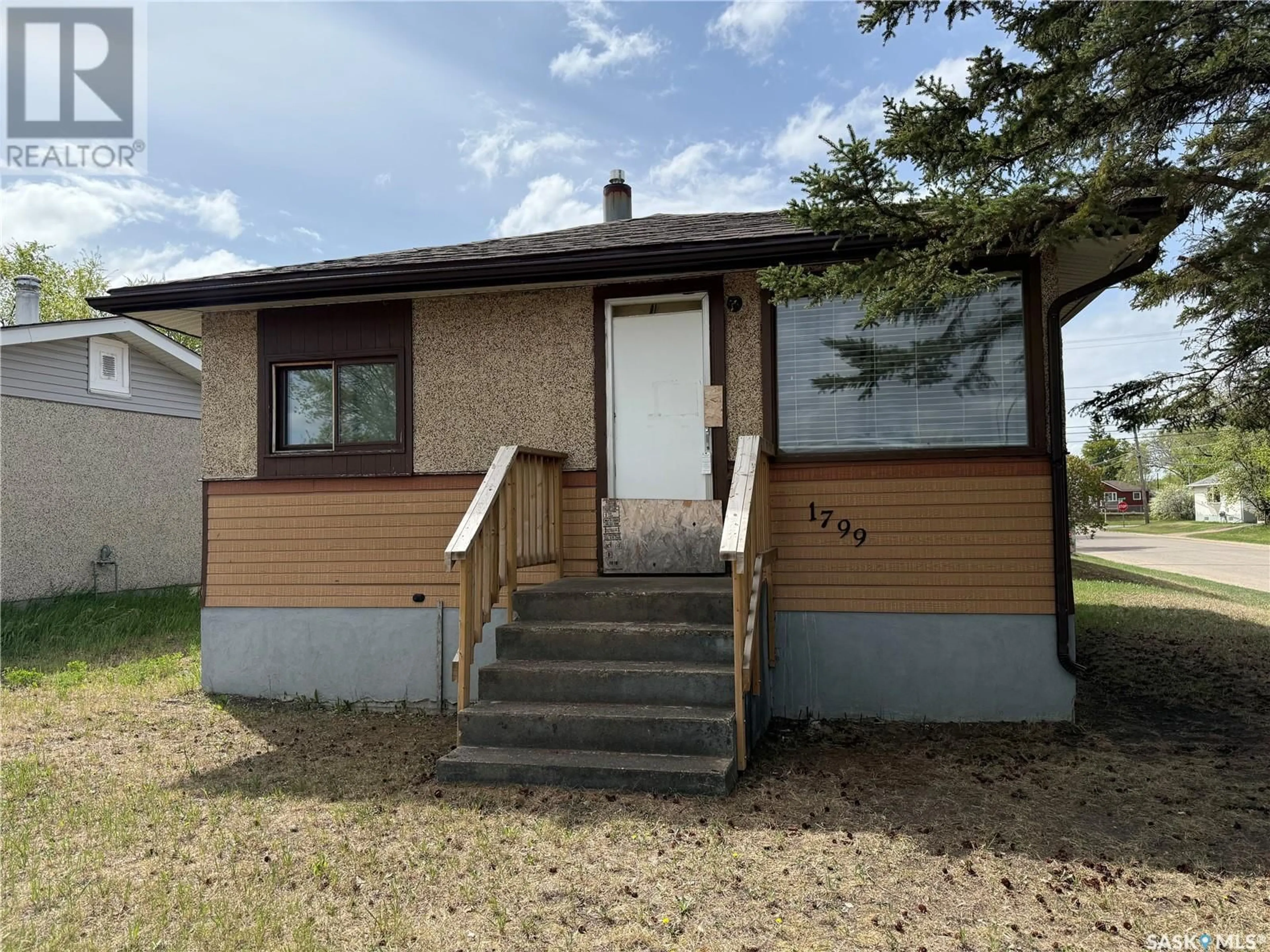 Home with vinyl exterior material, street for 1799 14TH STREET, Prince Albert Saskatchewan S6V3N7