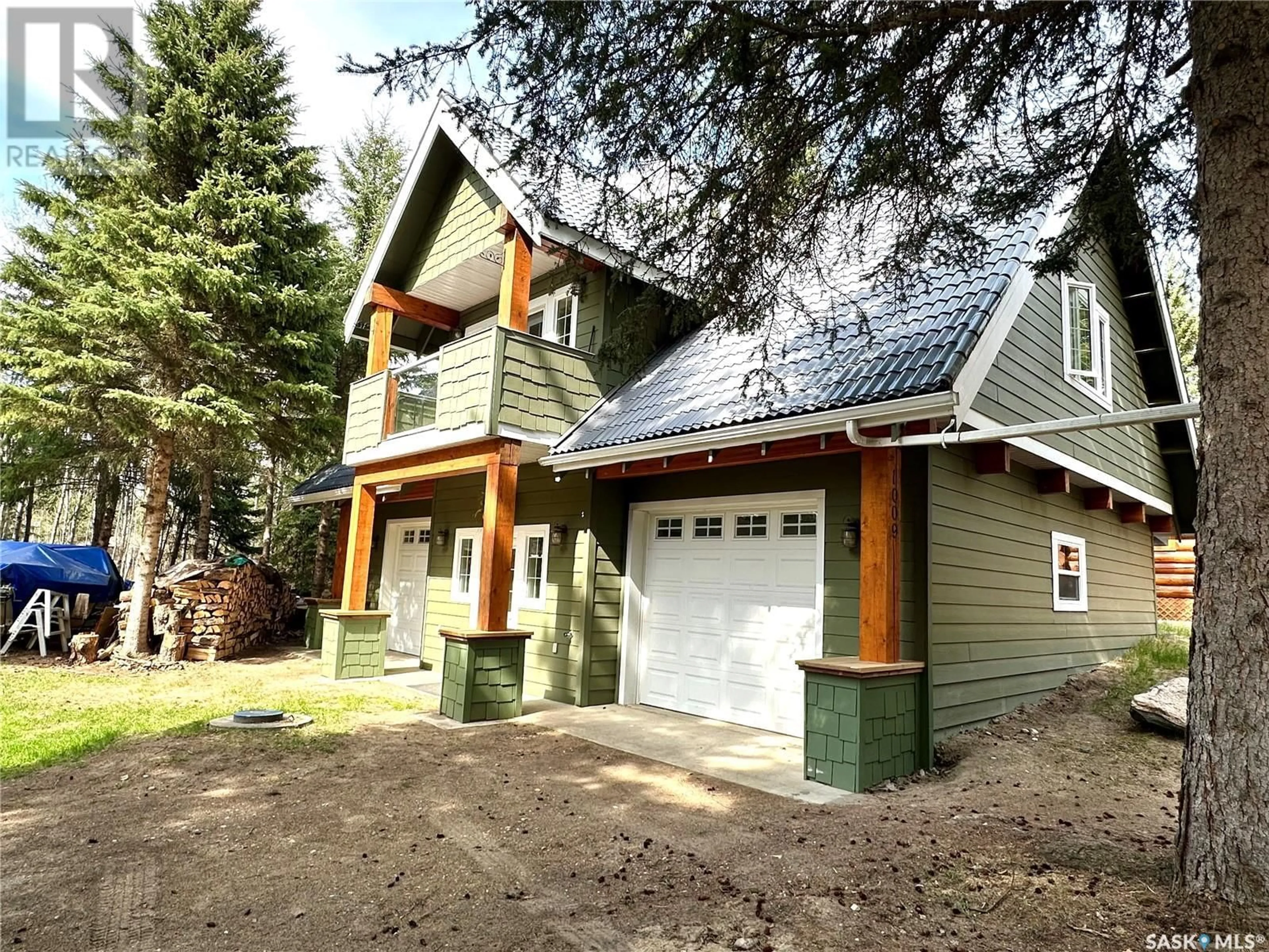 Home with vinyl exterior material, street for 1009 TRELAYNE PLACE, Brightsand Lake Saskatchewan S0M0H0