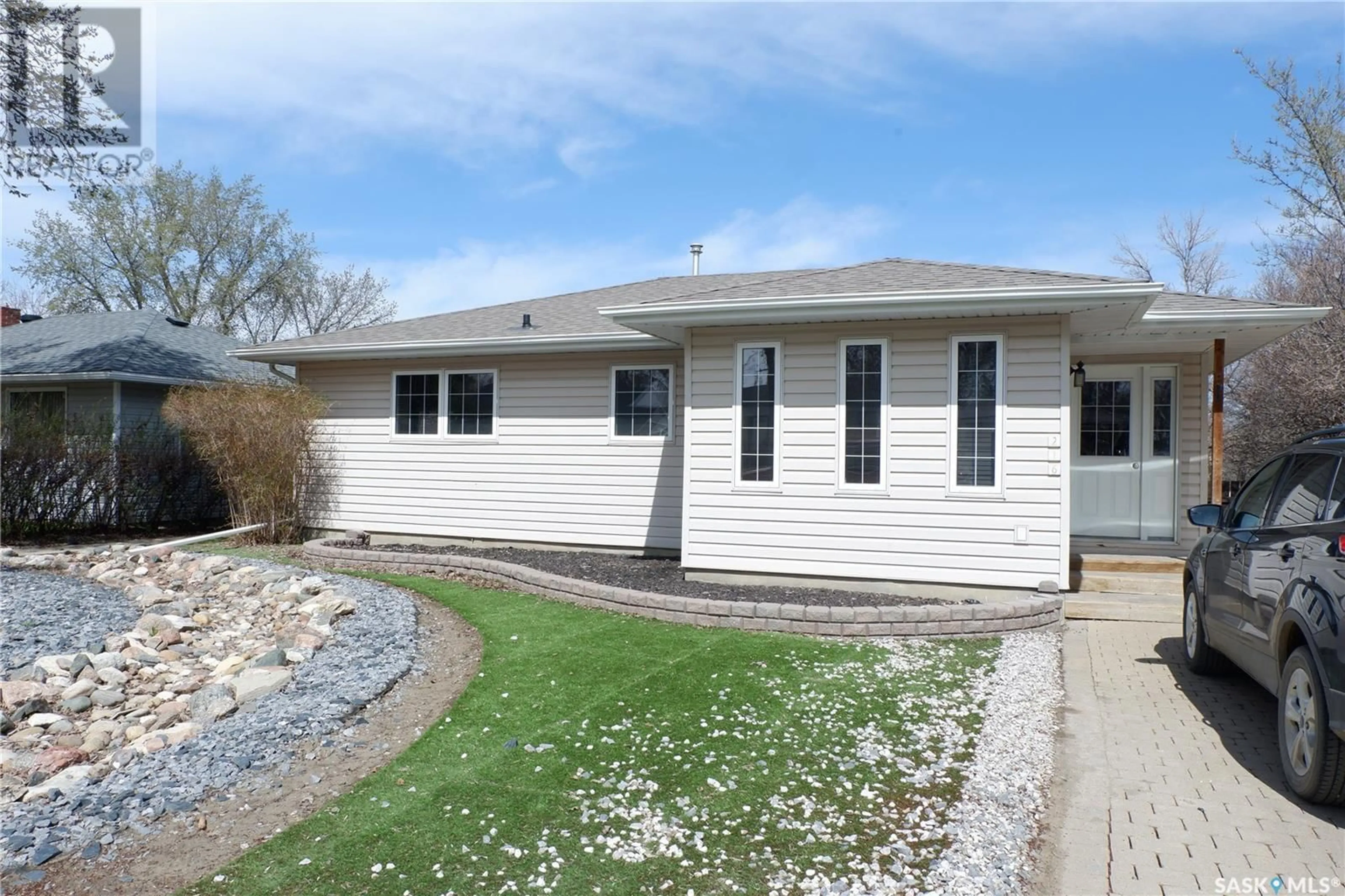 Home with vinyl exterior material, street for 216 DOMINION ROAD, Assiniboia Saskatchewan S0H0B0