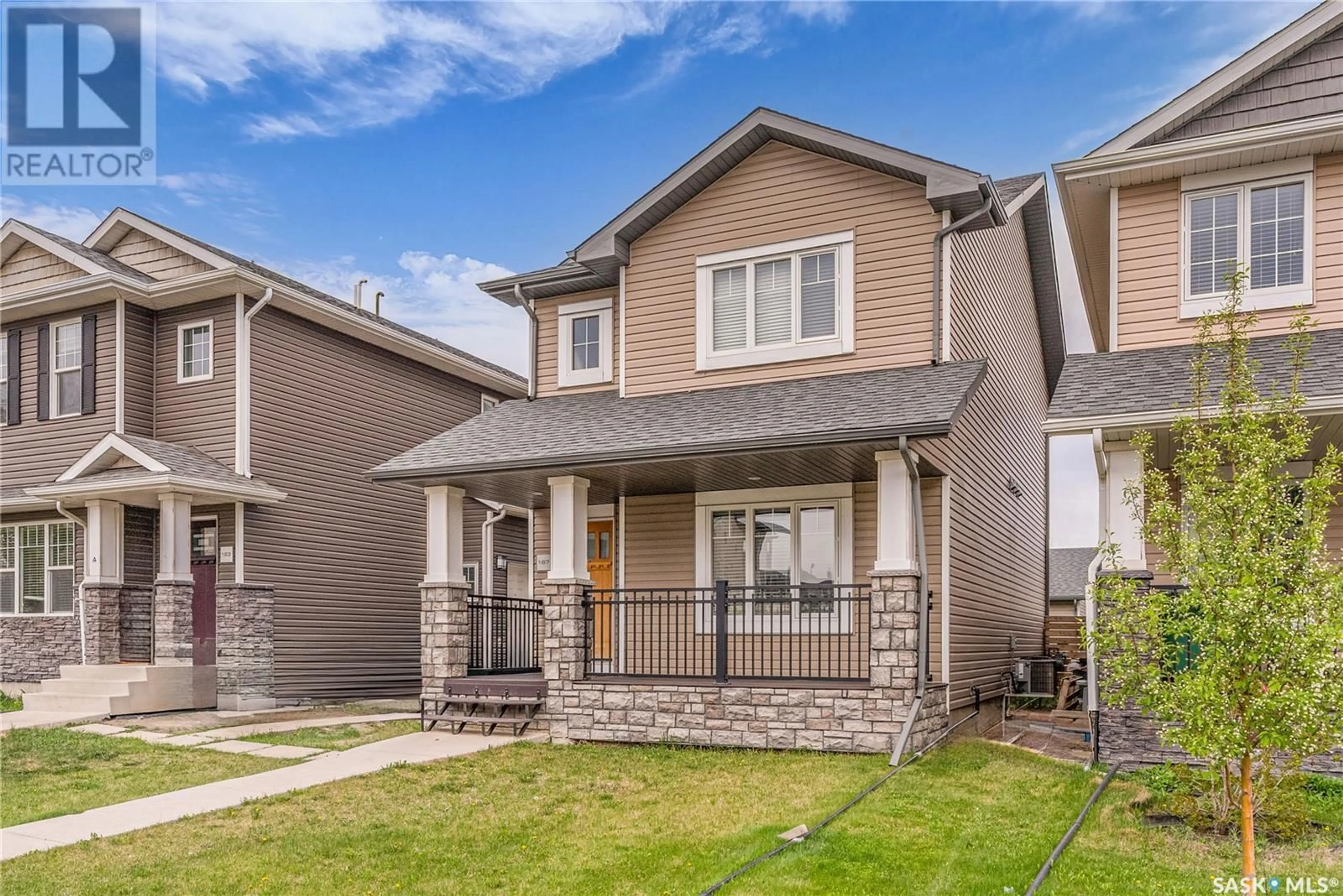 Home with vinyl exterior material, street for 167 TWEED LANE, Saskatoon Saskatchewan S7V0K1