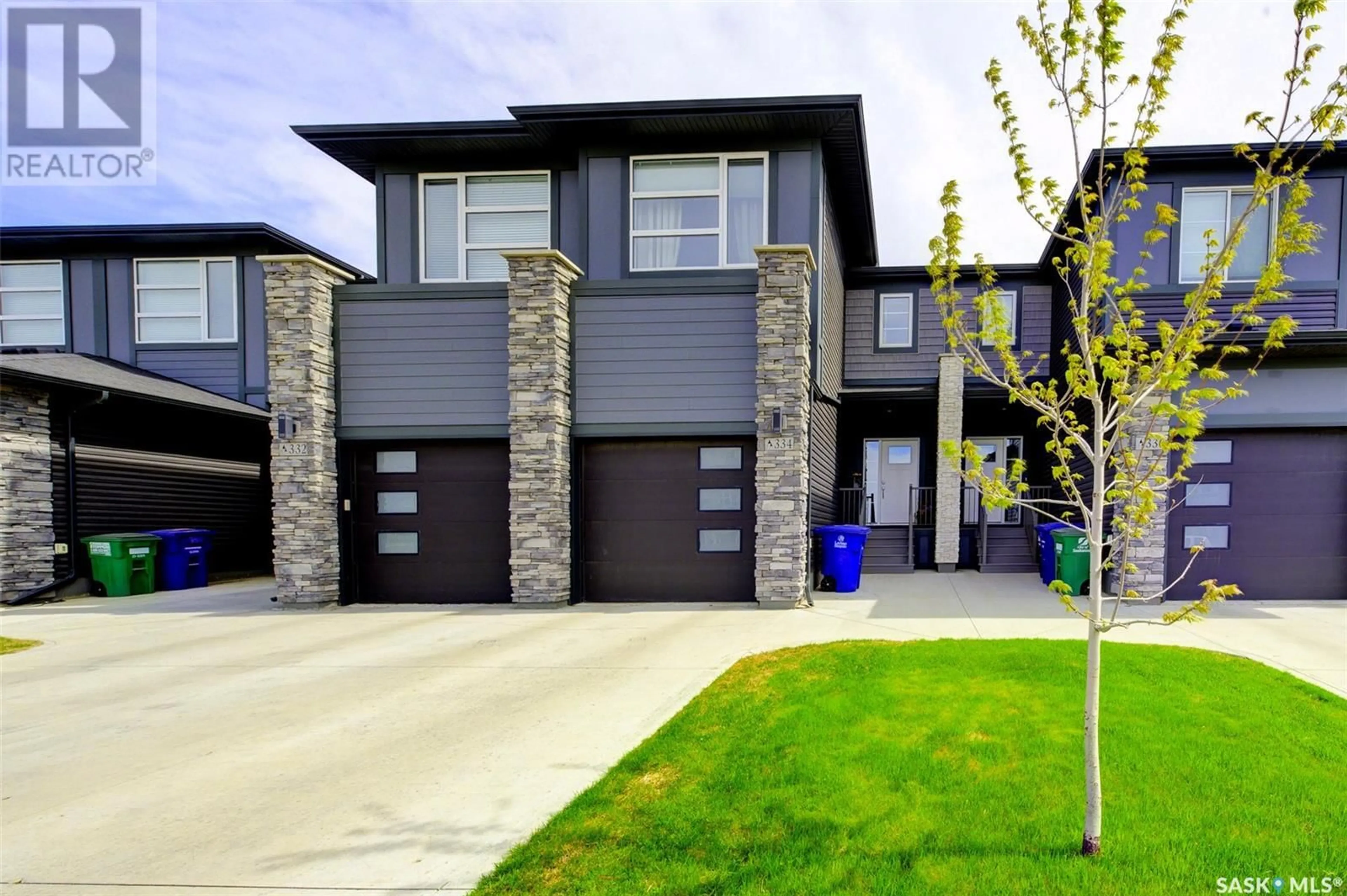 Home with brick exterior material, street for 334 BRIGHTON GATE, Saskatoon Saskatchewan S7V0R1