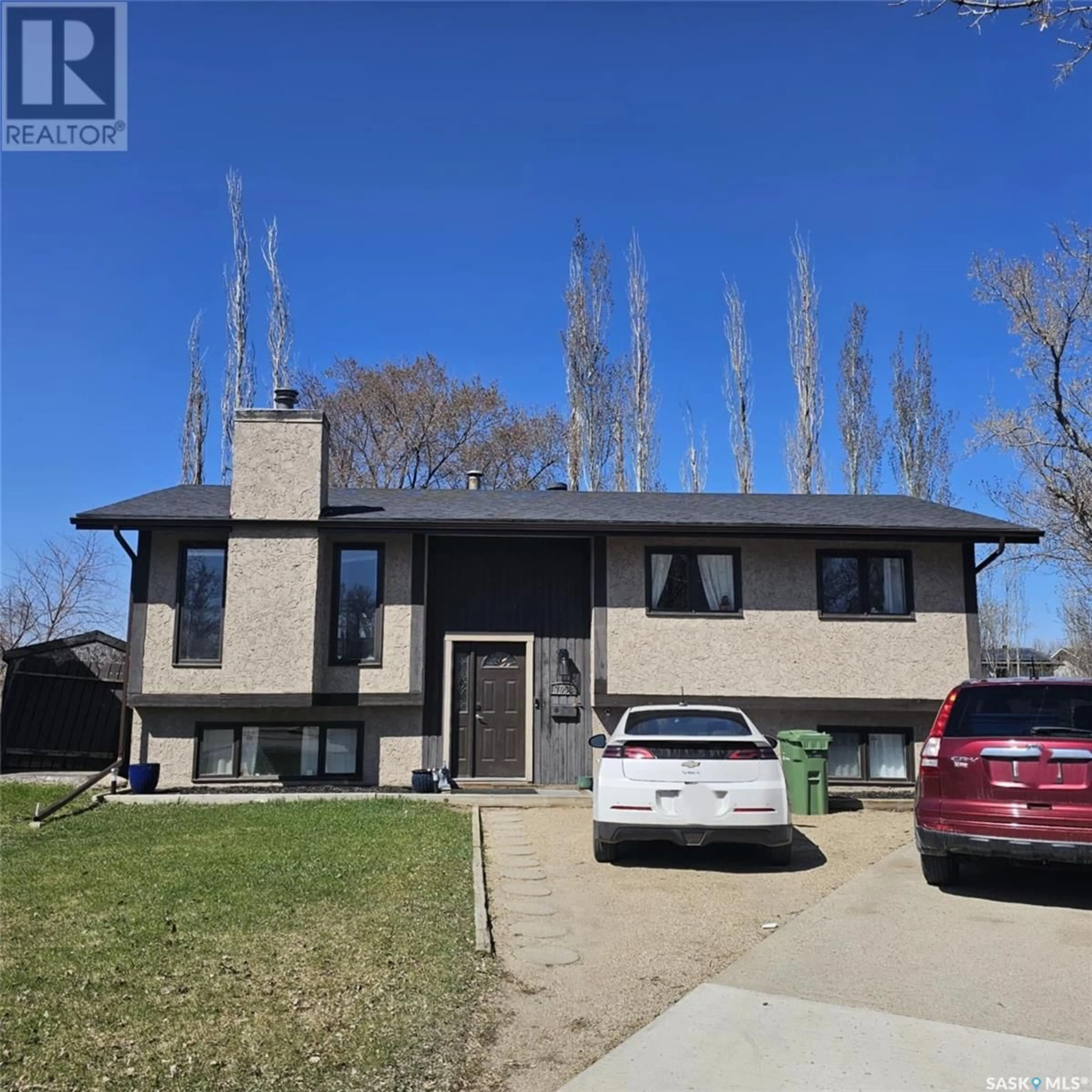Home with brick exterior material, street for 7058 BLAKENEY DRIVE, Regina Saskatchewan S4X2N5