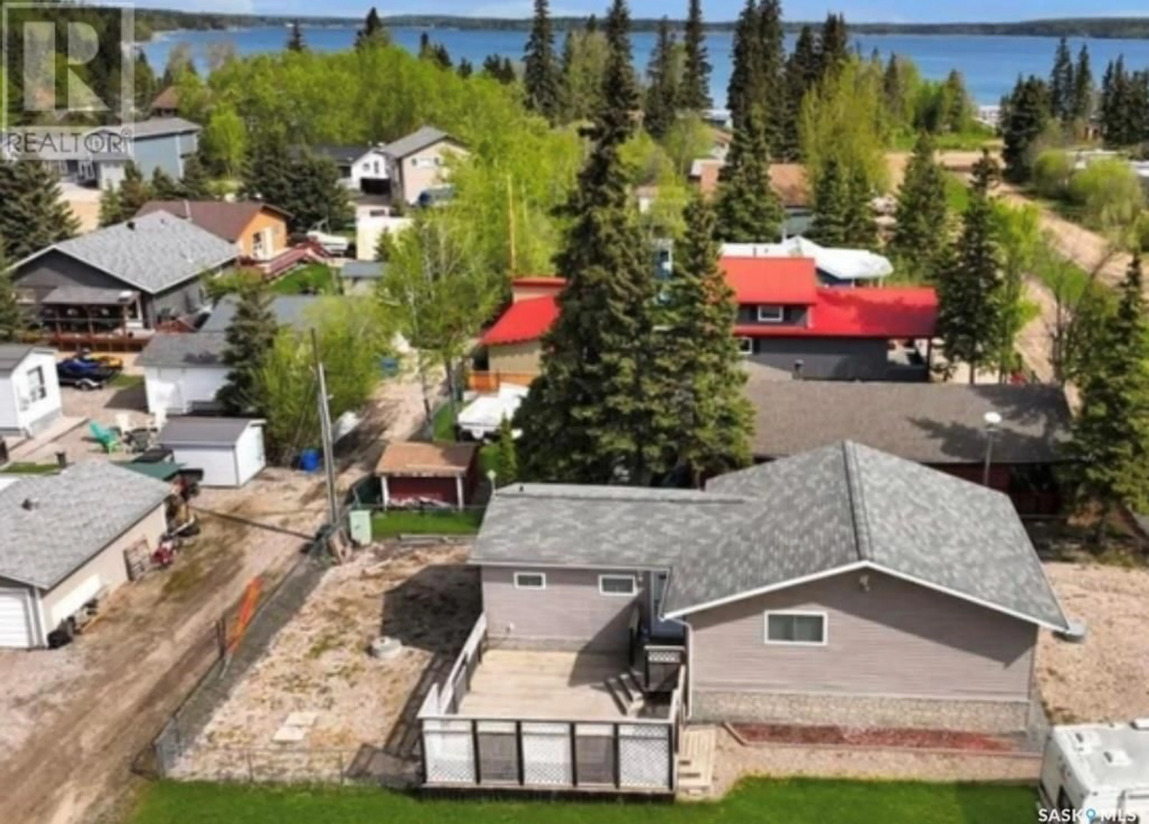 A pic from outside/outdoor area/front of a property/back of a property/a pic from drone, water/lake/river/ocean view for 502 SOUTHSHORE DRIVE, Emma Lake Saskatchewan S0J0N0