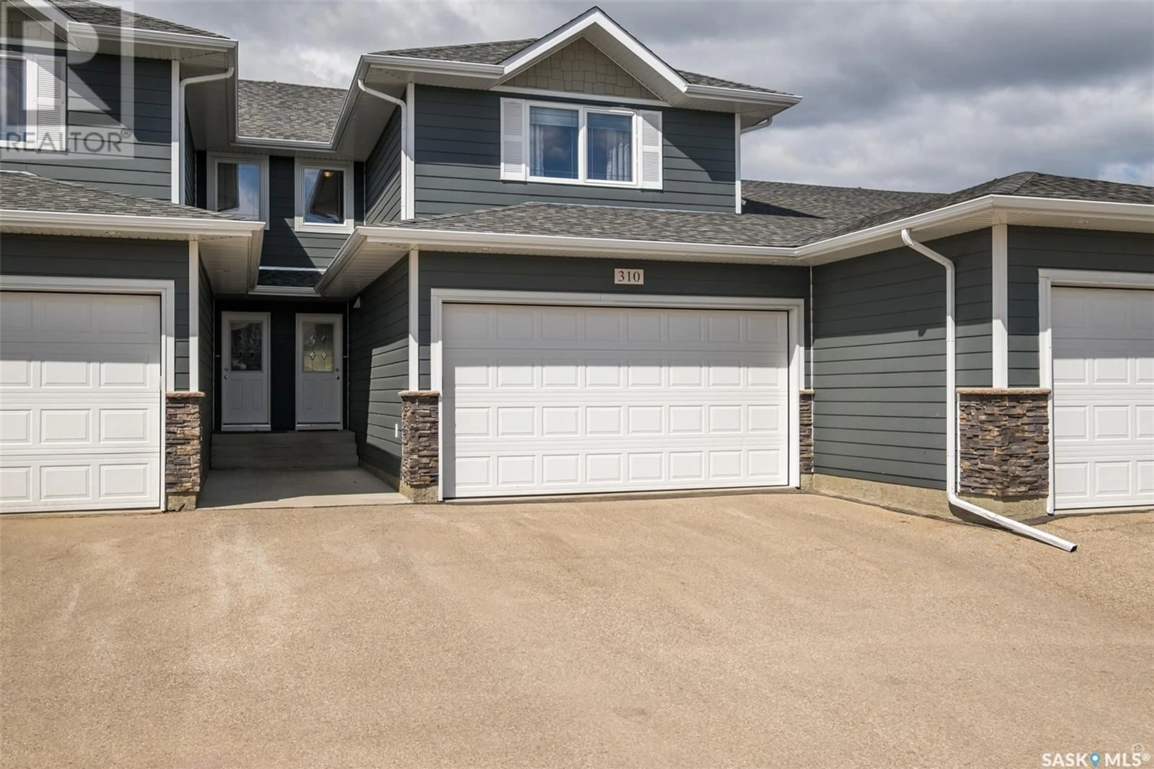 Home with vinyl exterior material, street for 310 - 1851 PEDERSON DRIVE, Prince Albert Saskatchewan S6X0B2