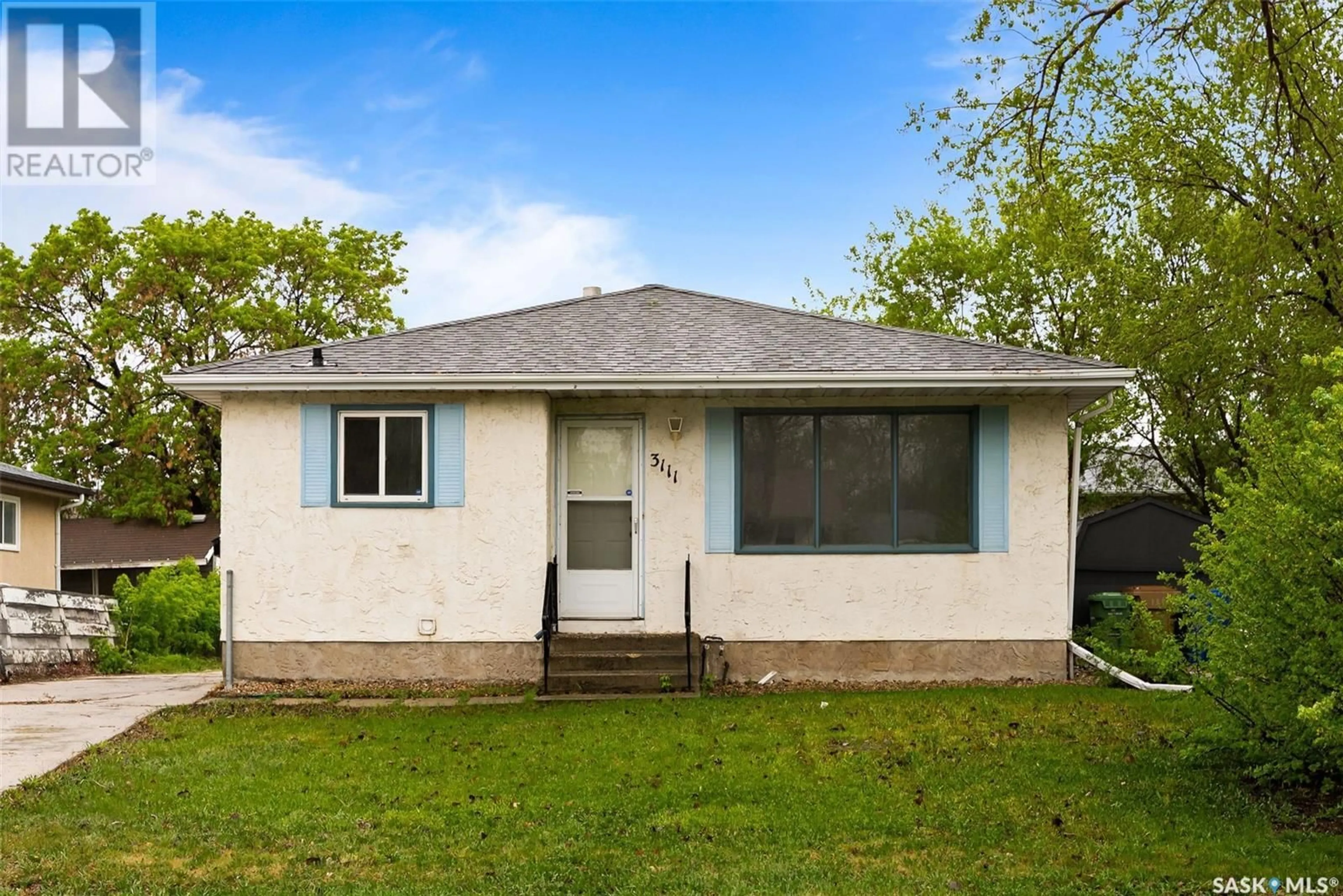 Home with vinyl exterior material, street for E - 3111 DEWDNEY AVENUE, Regina Saskatchewan S4N5K3
