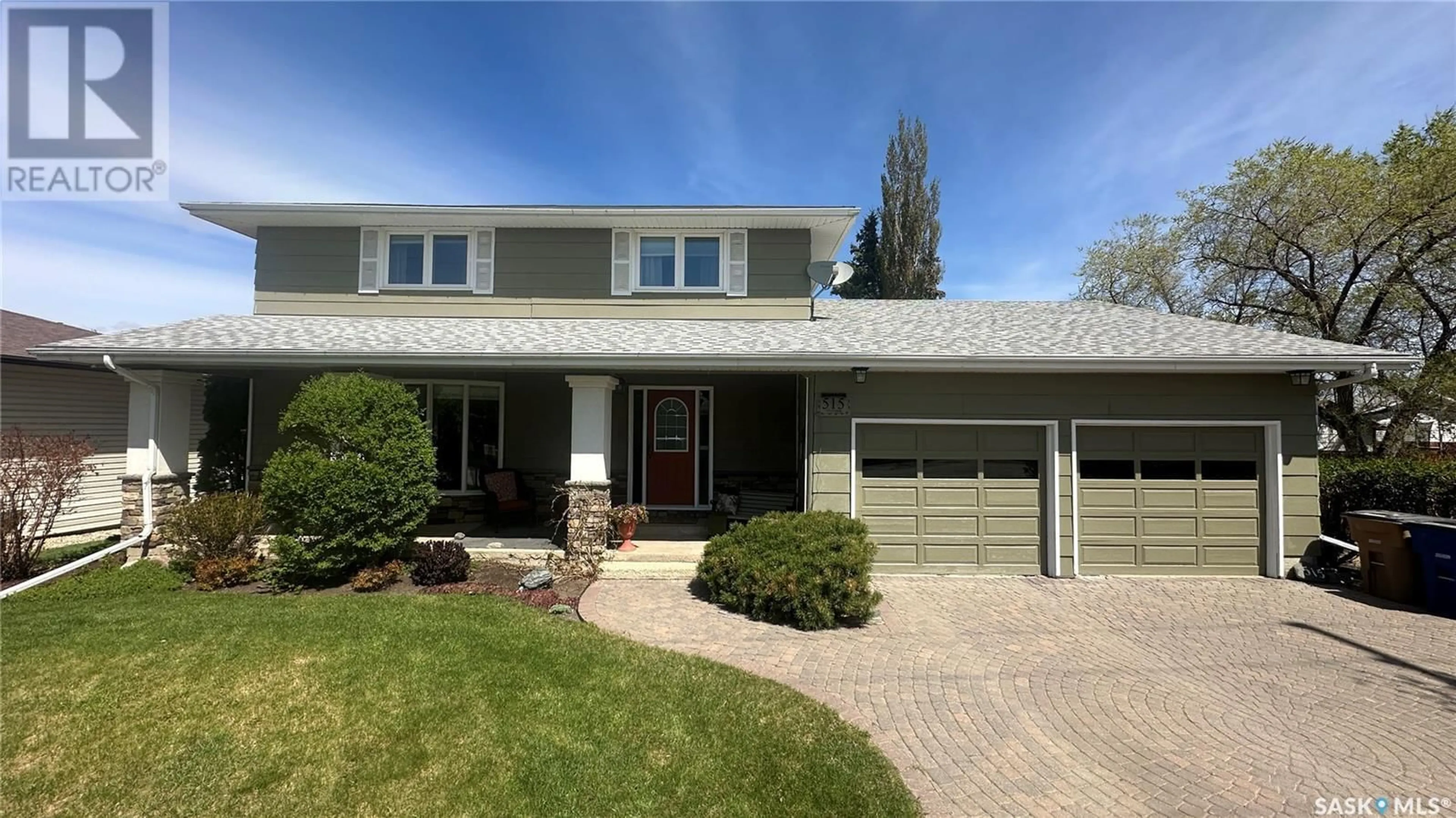 Home with vinyl exterior material, street for 515 103RD AVENUE, Tisdale Saskatchewan S0E1T0