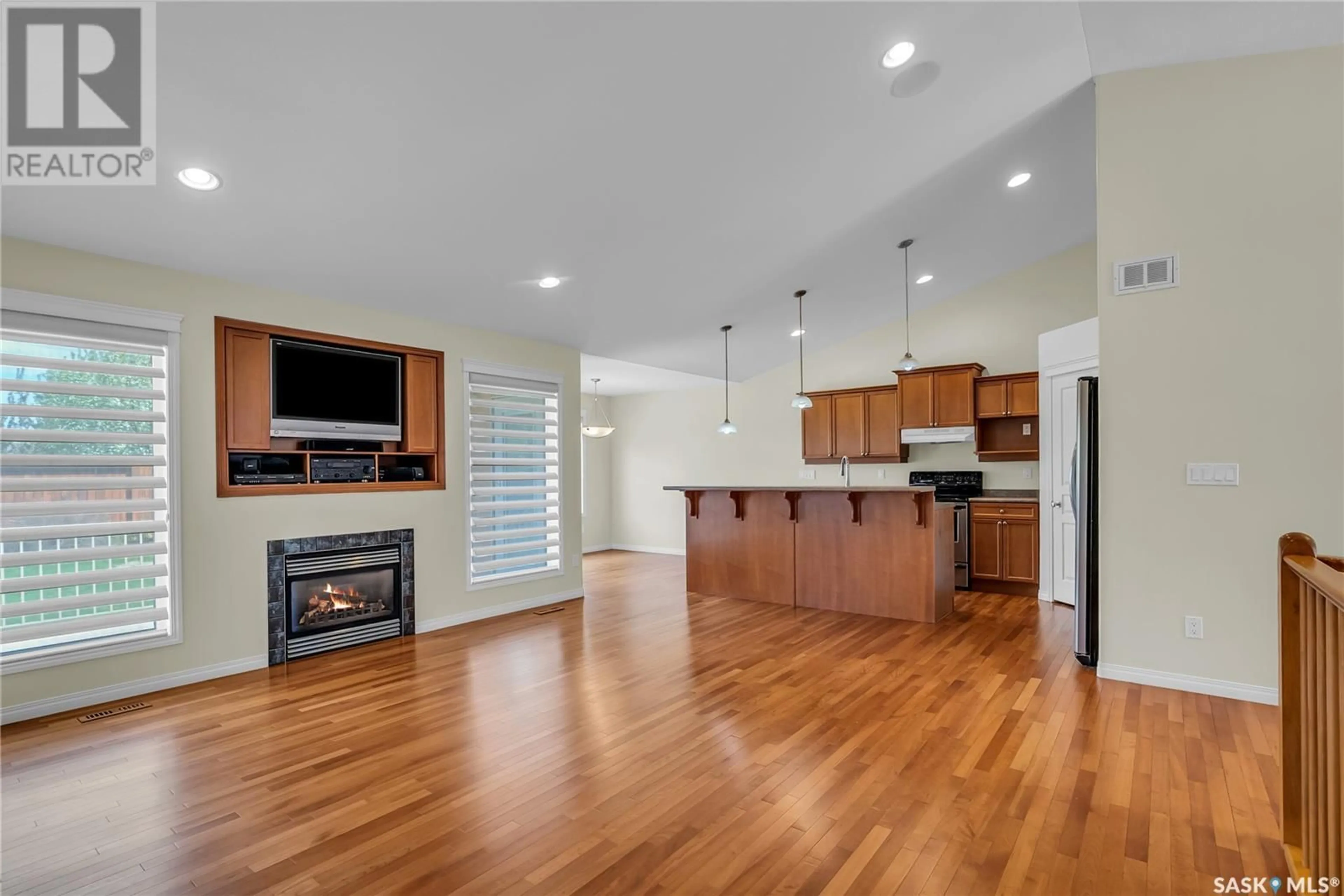 Open concept kitchen, wood/laminate floor for 327 BOLTON WAY, Saskatoon Saskatchewan S7T0A2