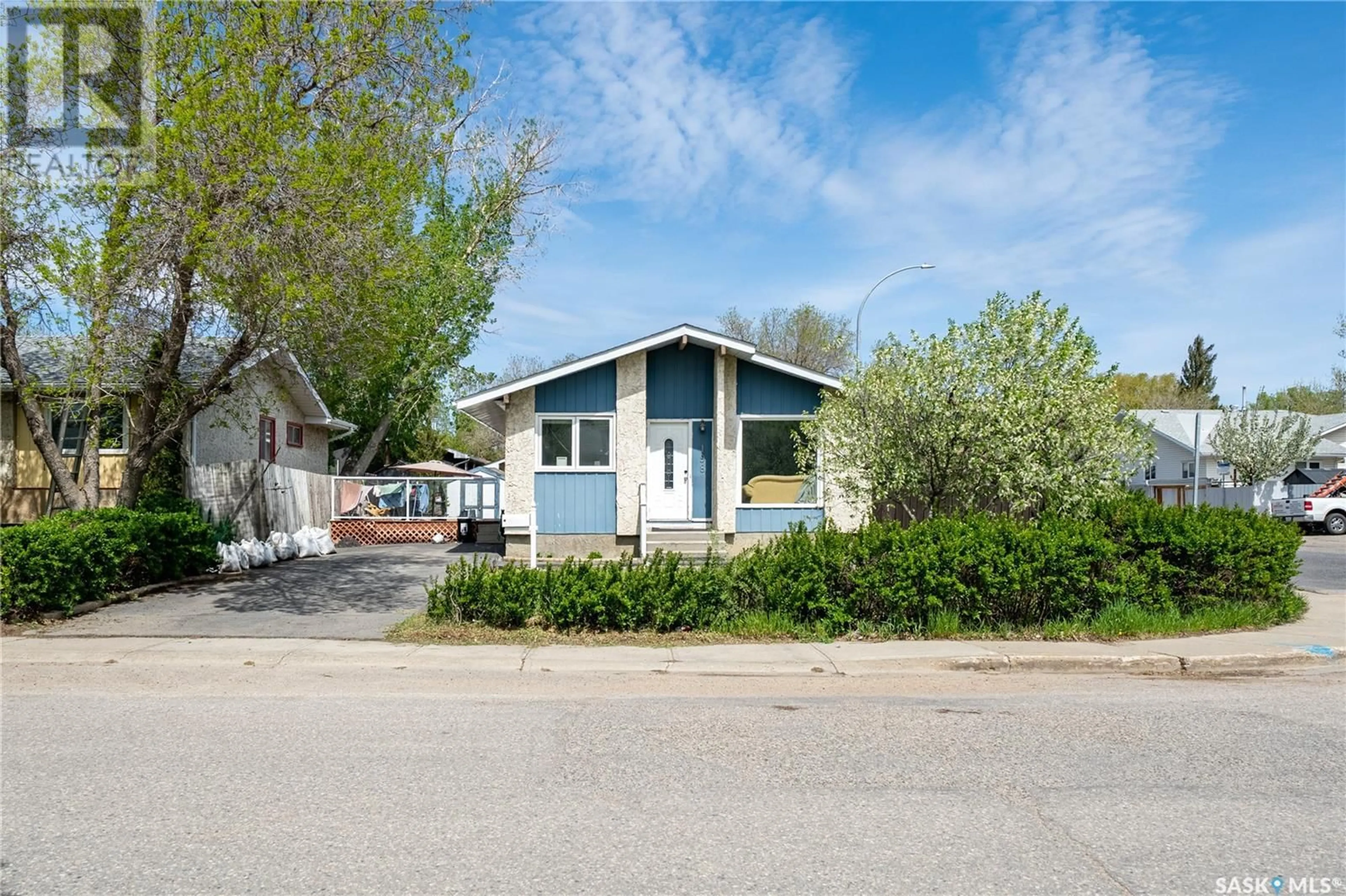 Home with vinyl exterior material, street for 198 THOMSON AVENUE, Regina Saskatchewan S4N5L3