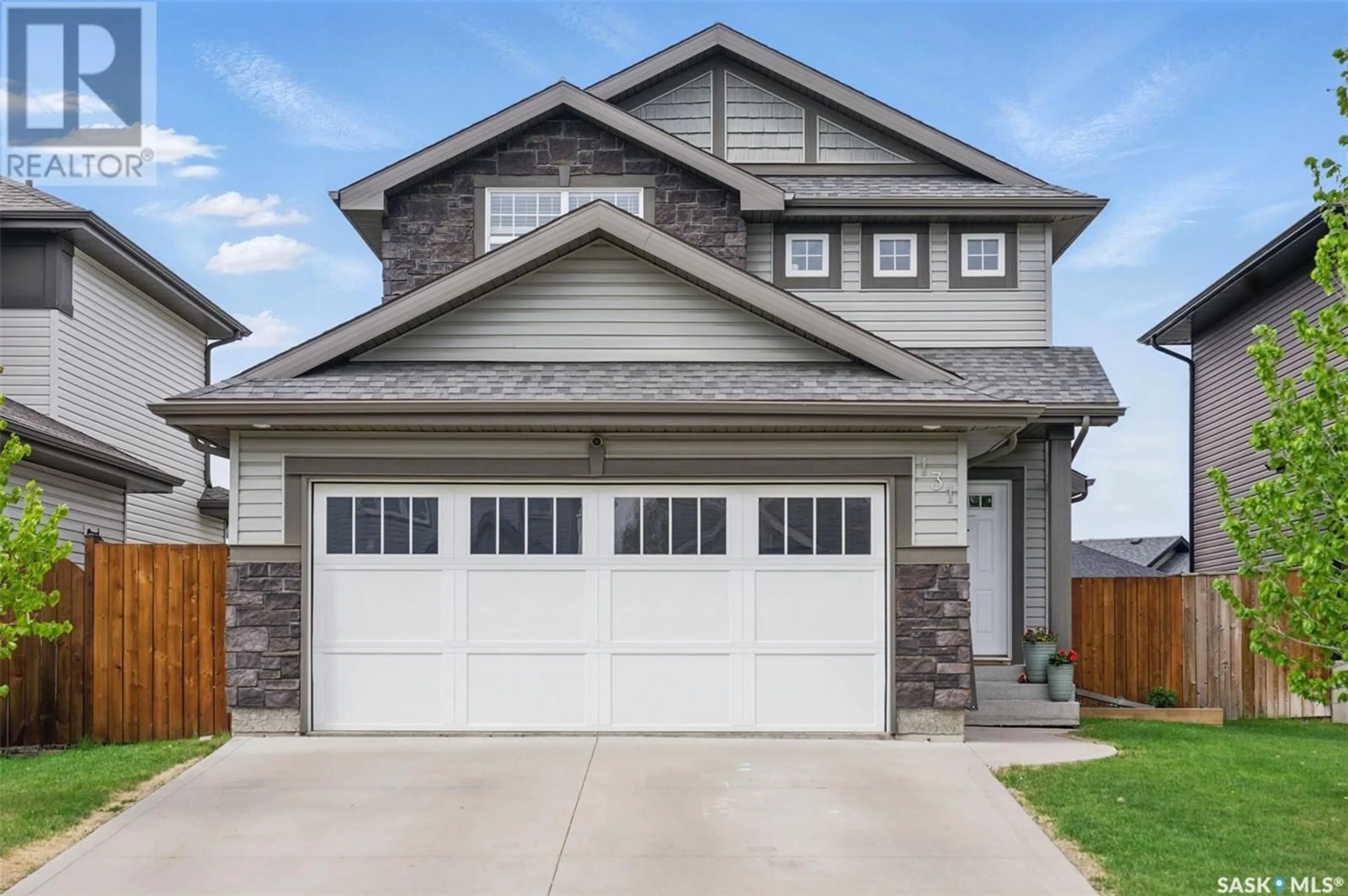 Home with vinyl exterior material, street for 131 CHILDERS CRESCENT, Saskatoon Saskatchewan S7L3G4
