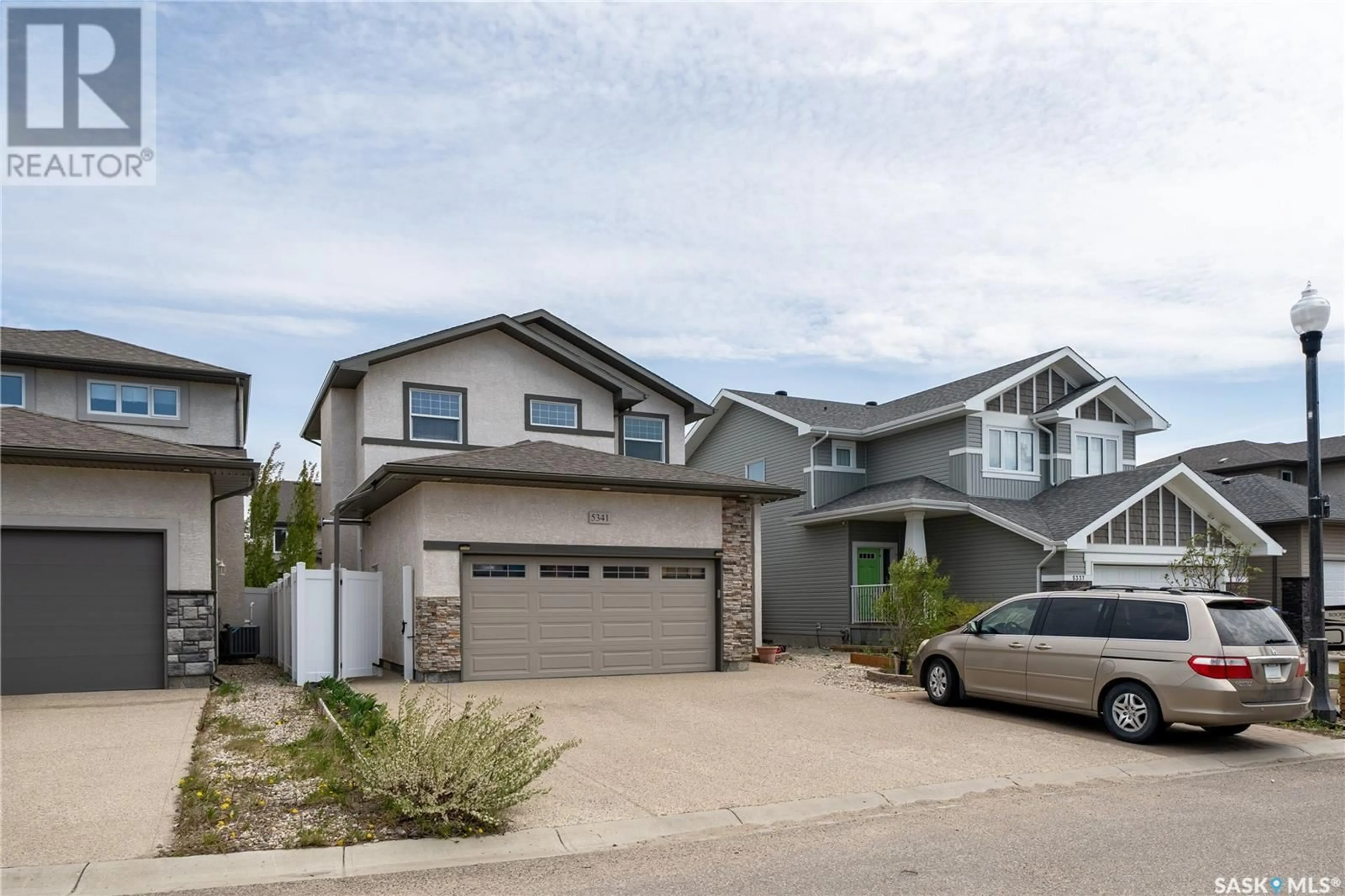 Home with vinyl exterior material, street for 5341 MCKENNA CRESCENT, Regina Saskatchewan S4W0H3