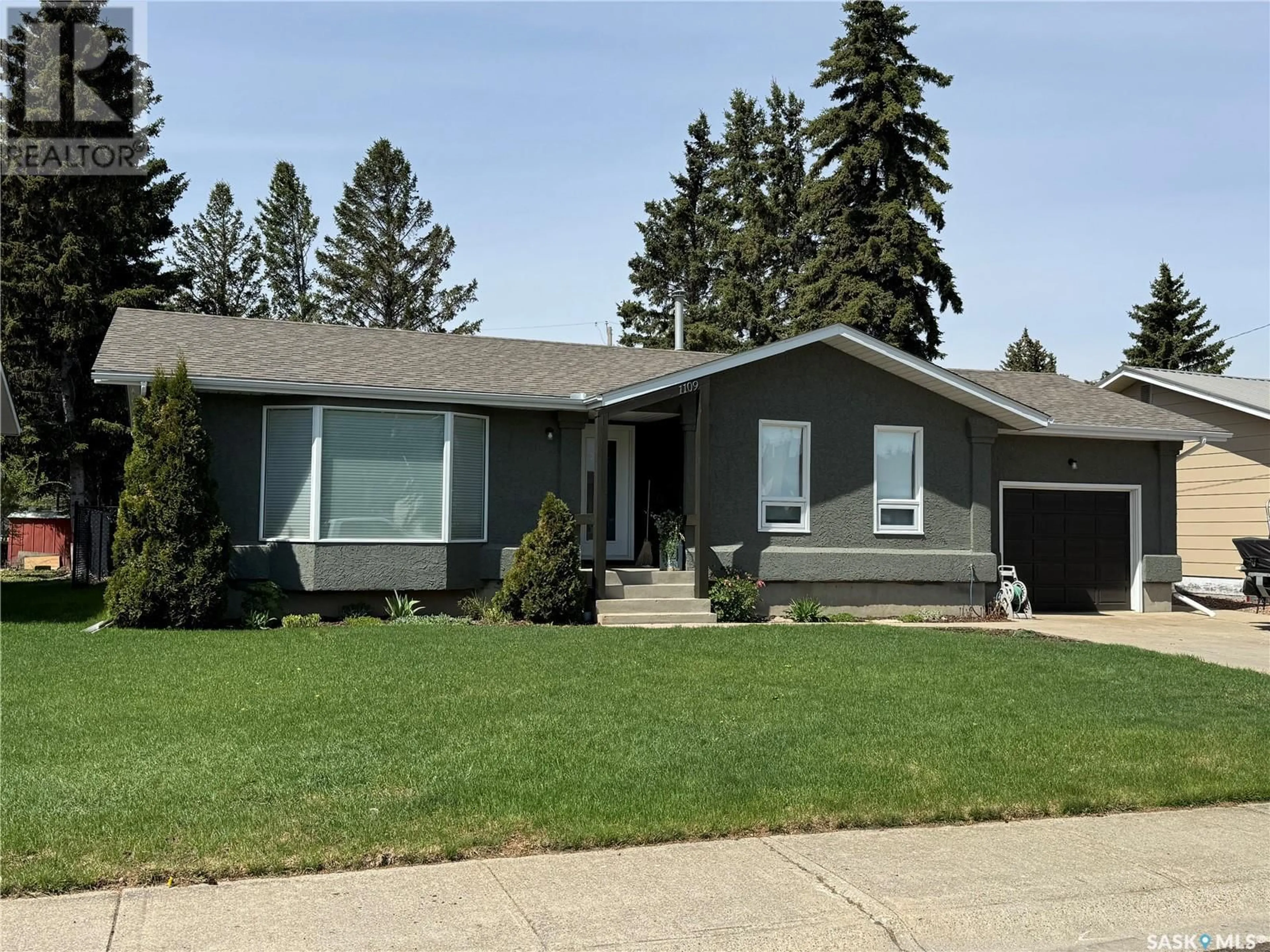 Home with vinyl exterior material, street for 1109 10TH STREET, Humboldt Saskatchewan S0K2A0