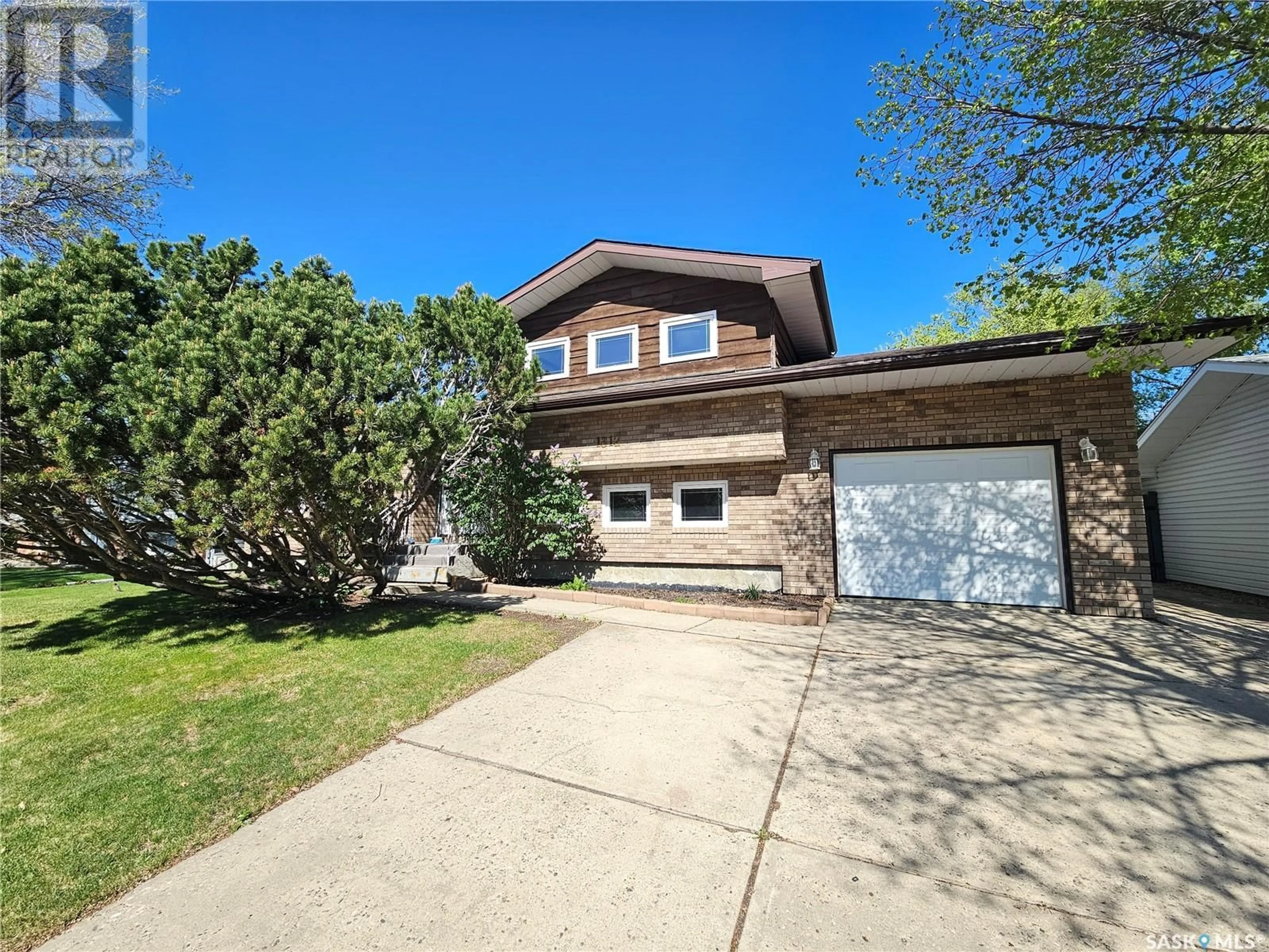 Home with vinyl exterior material, street for 1312 PRINCESS CRESCENT, Moose Jaw Saskatchewan S6H6S9