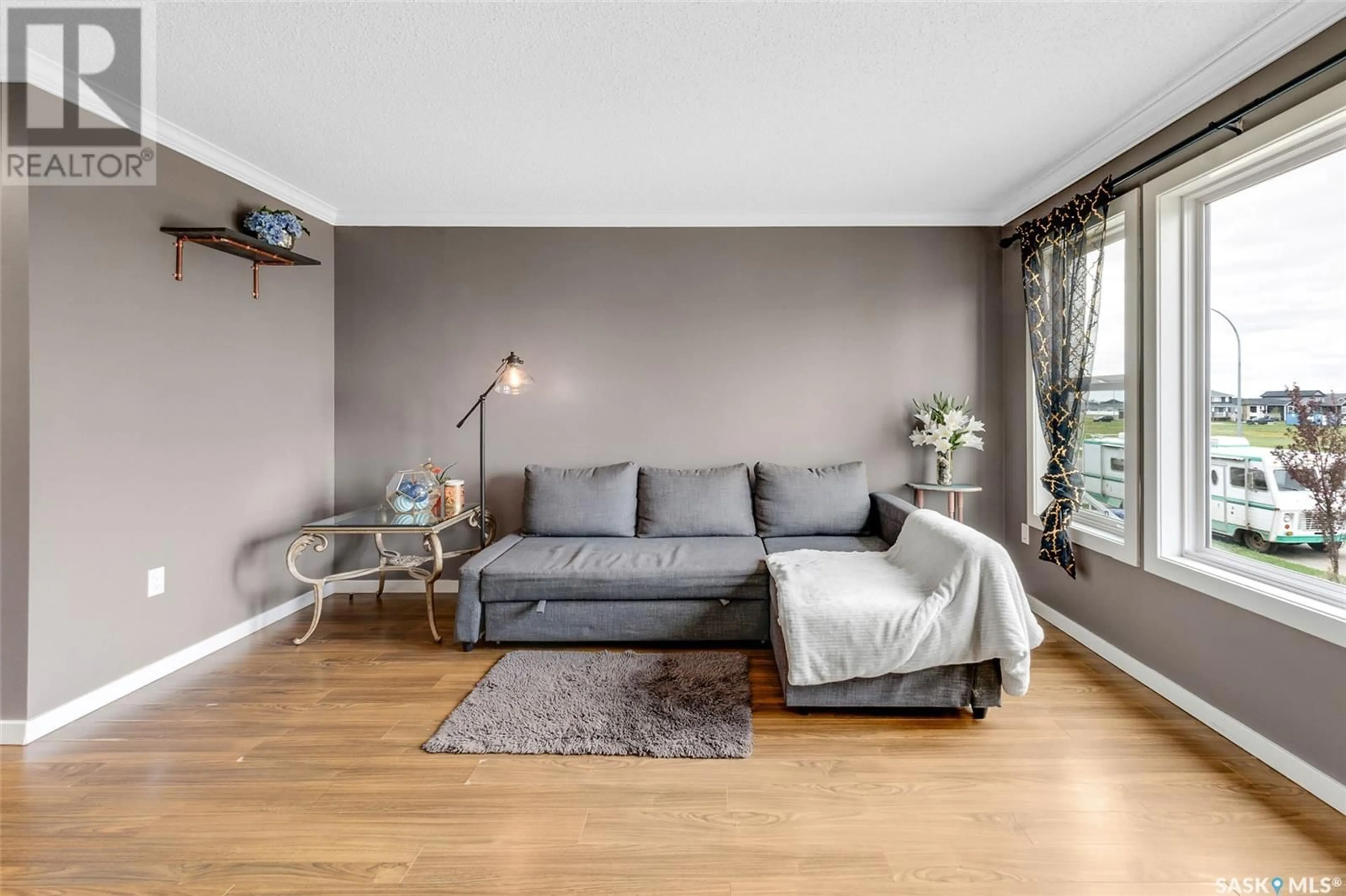 Living room with furniture, wood/laminate floor for N - 207 ROSEWOOD GATE, Saskatoon Saskatchewan S7V0J2