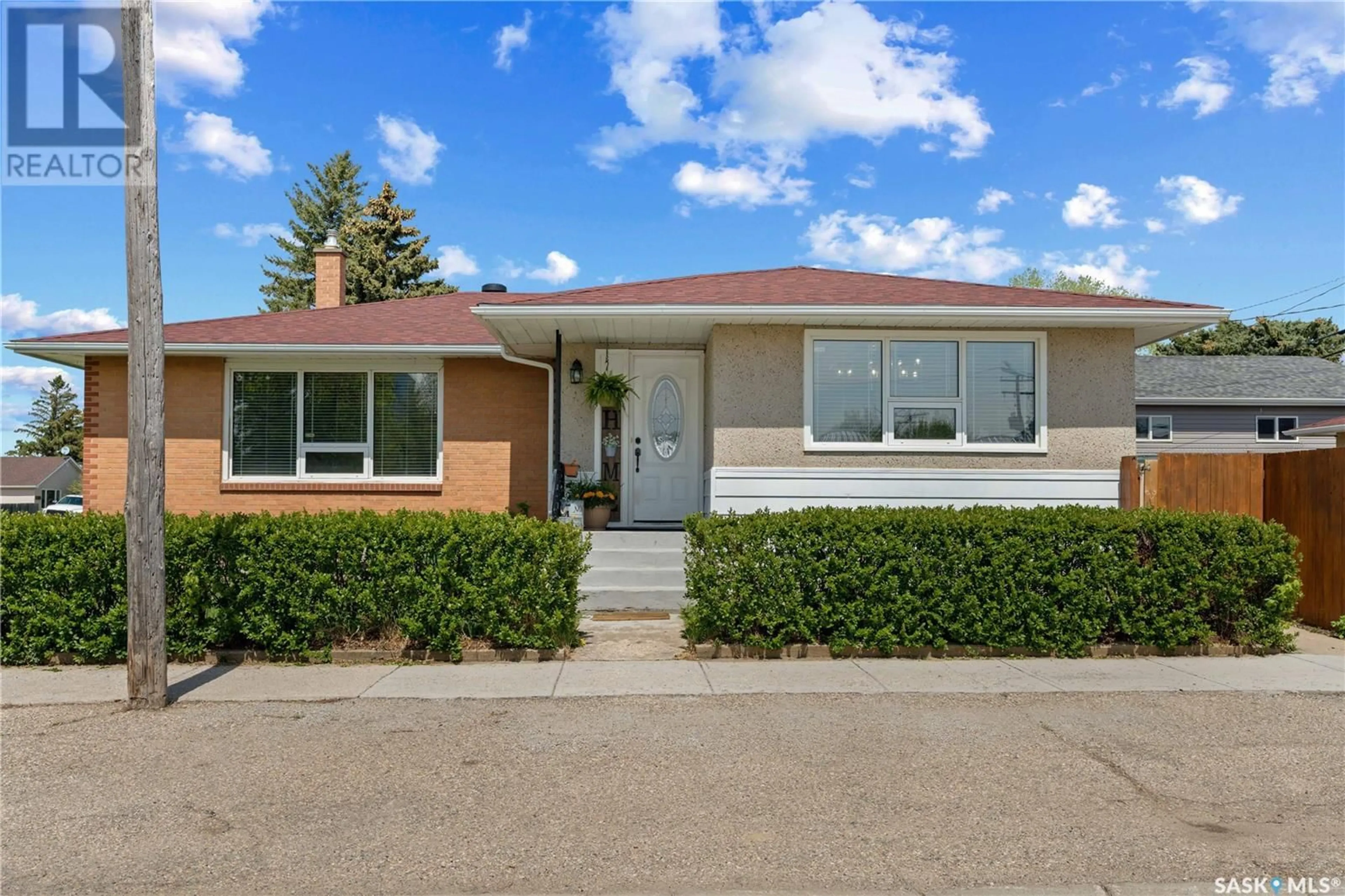 Home with brick exterior material, street for 384 ASSINIBOIA AVENUE, Southey Saskatchewan S0G4P0