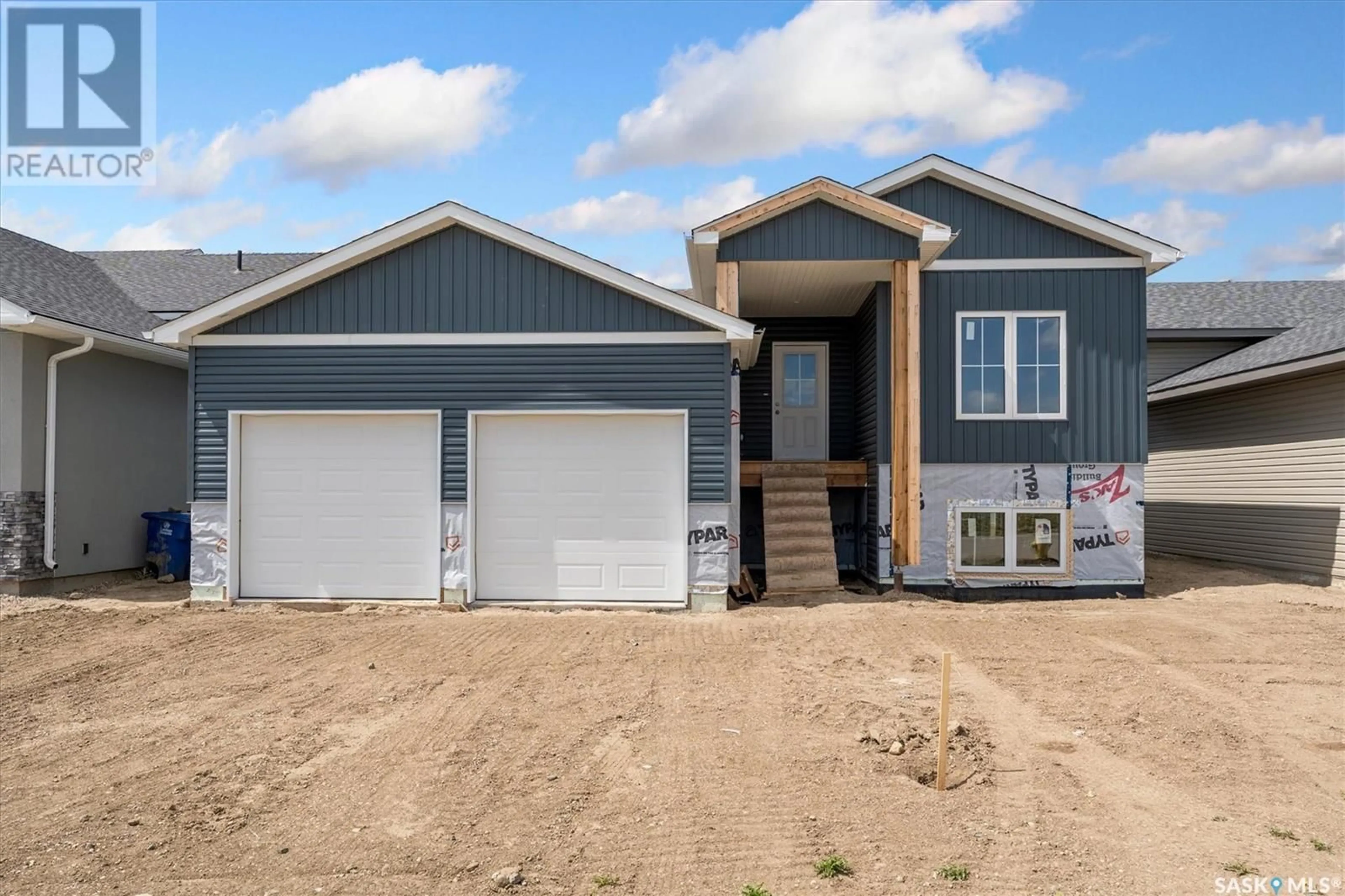 Home with vinyl exterior material, street for 246 PRAIRIE DAWN DRIVE, Dundurn Saskatchewan S0K1K1