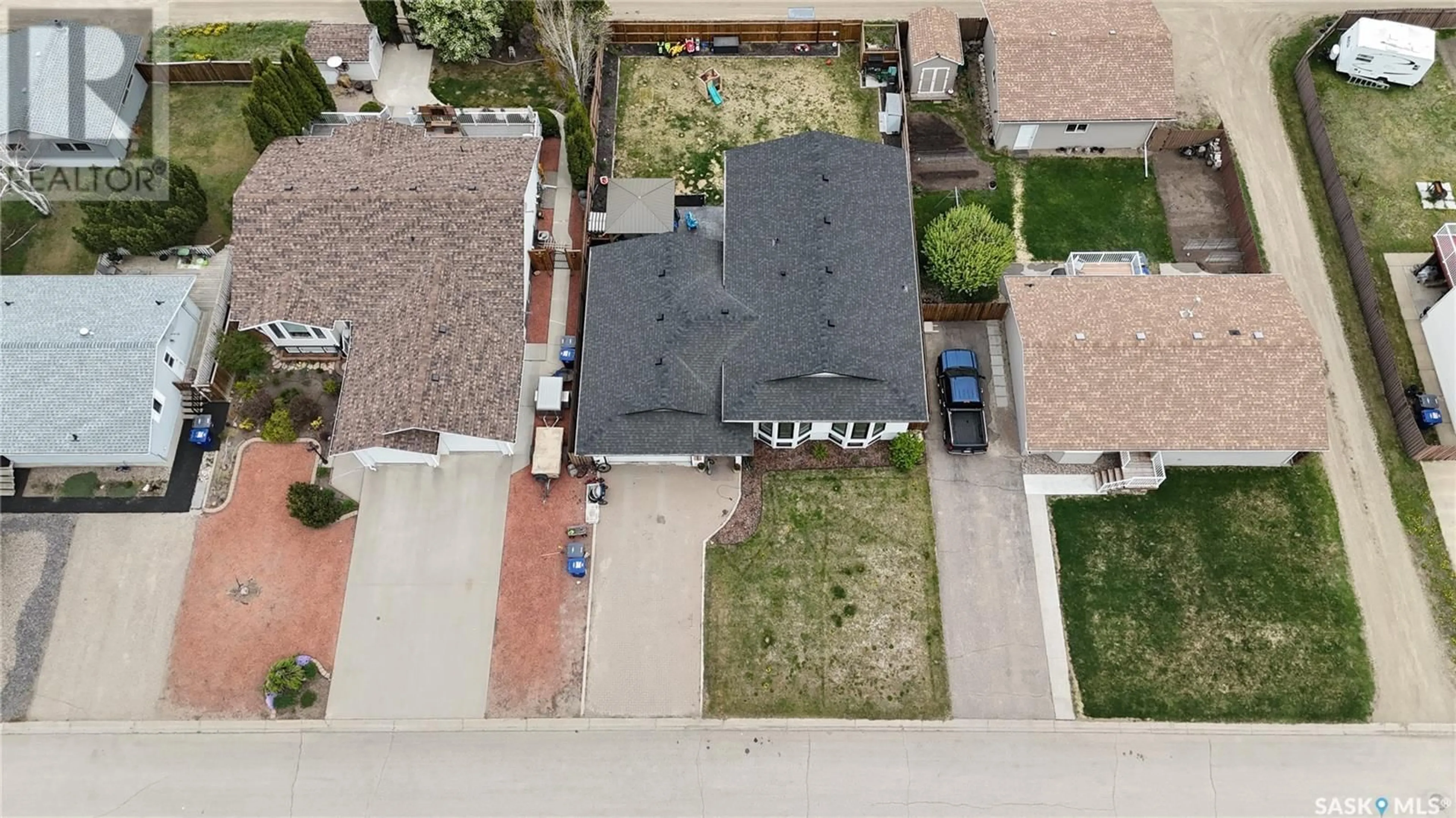 A pic from outside/outdoor area/front of a property/back of a property/a pic from drone, street for 411 MCGILLIVRAY STREET, Outlook Saskatchewan S0L2N0