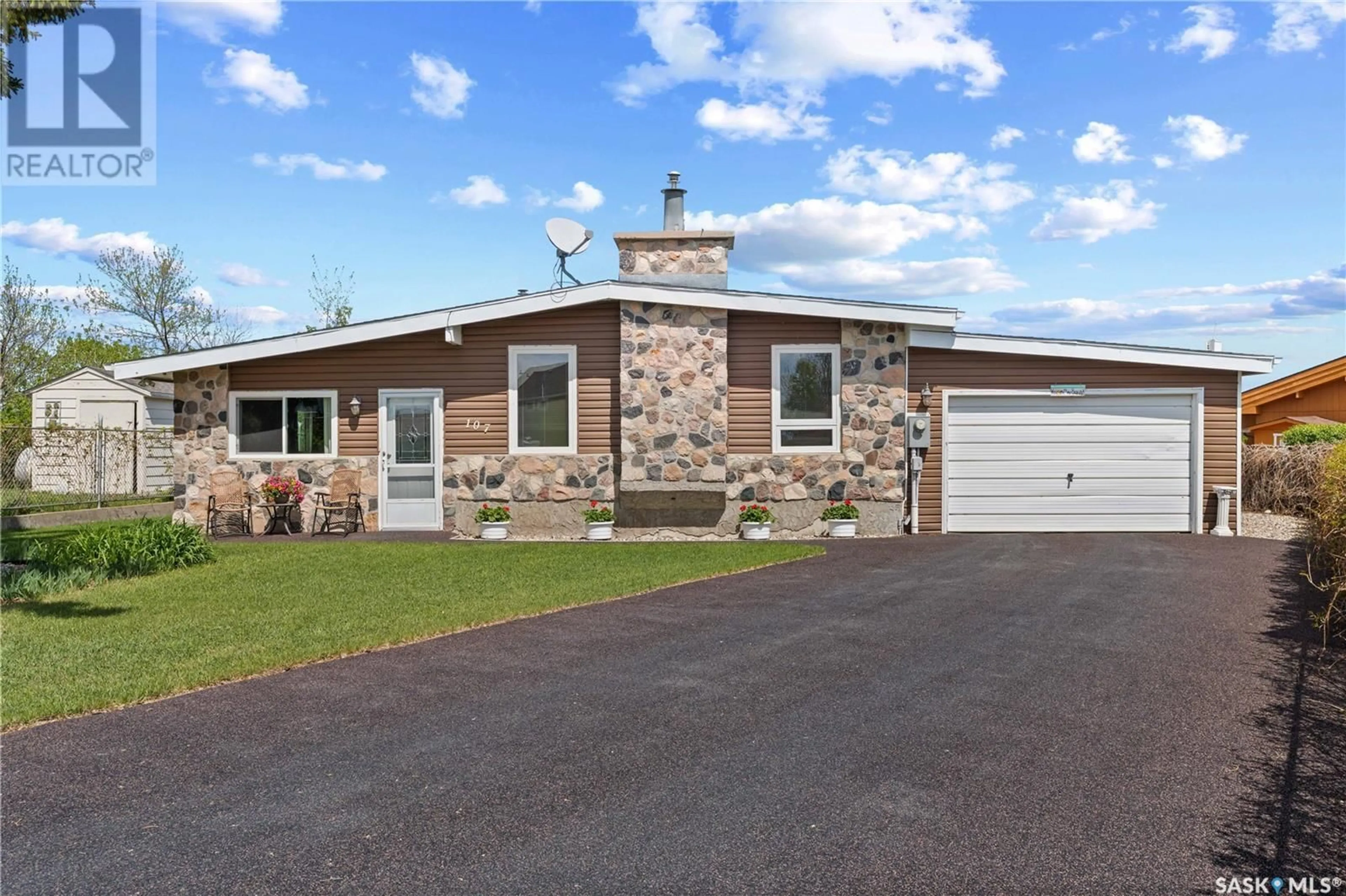 Home with vinyl exterior material, street for 107 BARBER PLACE, Regina Beach Saskatchewan S0G4C0
