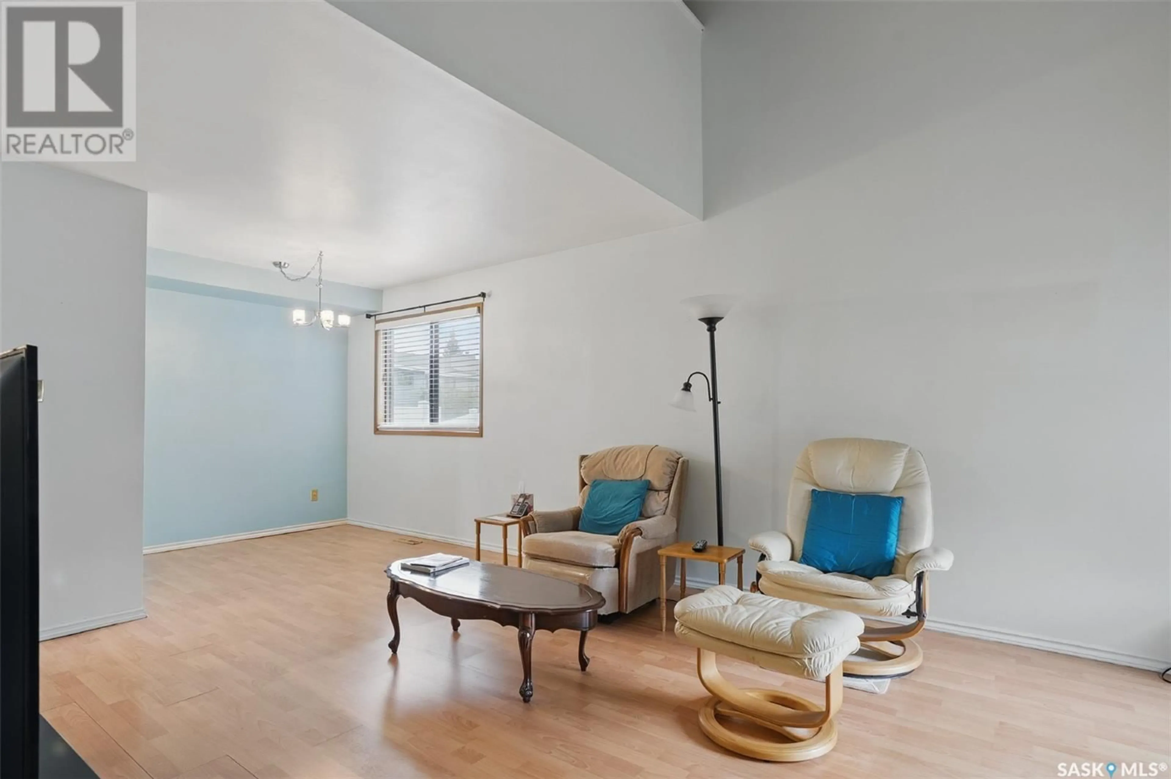 Living room with furniture, wood/laminate floor for 154 227 SAGUENAY DRIVE, Saskatoon Saskatchewan S7K6G4
