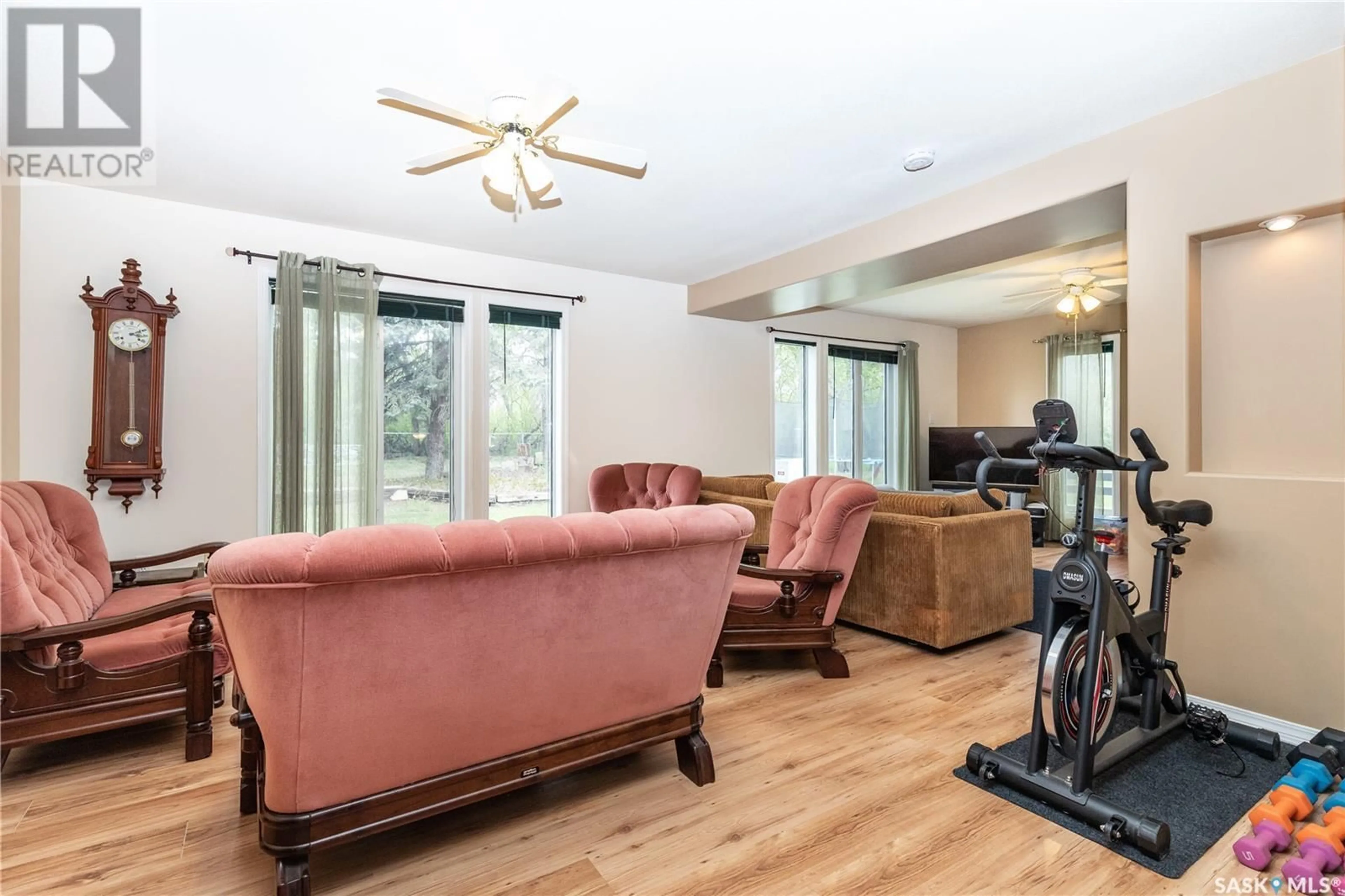 Living room with furniture, wood/laminate floor for BORDEN ACREAGE, Great Bend Rm No. 405 Saskatchewan S0K0N0