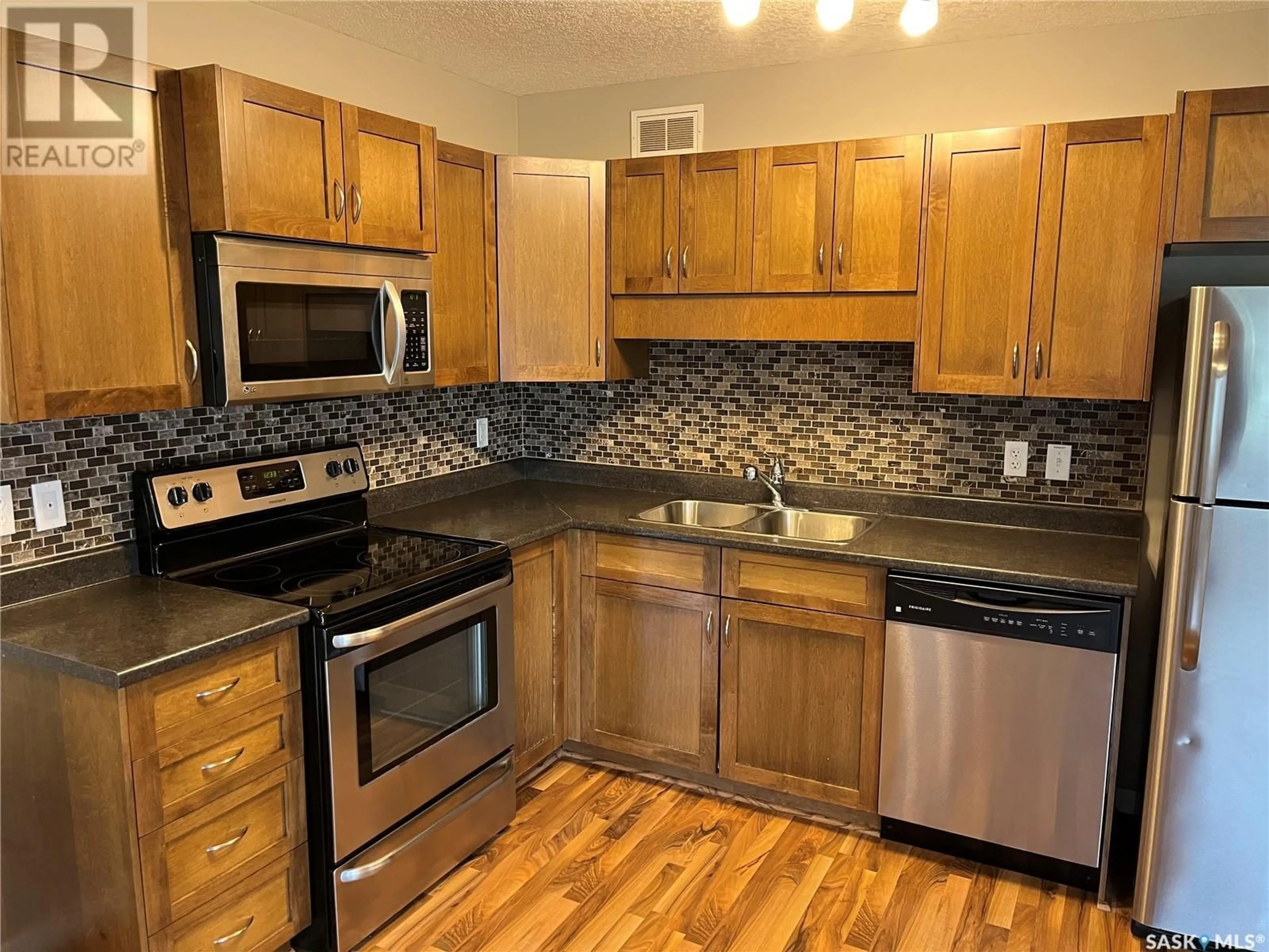 Standard kitchen, wood/laminate floor for 123 5059 JAMES HILL ROAD, Regina Saskatchewan S4W0B9
