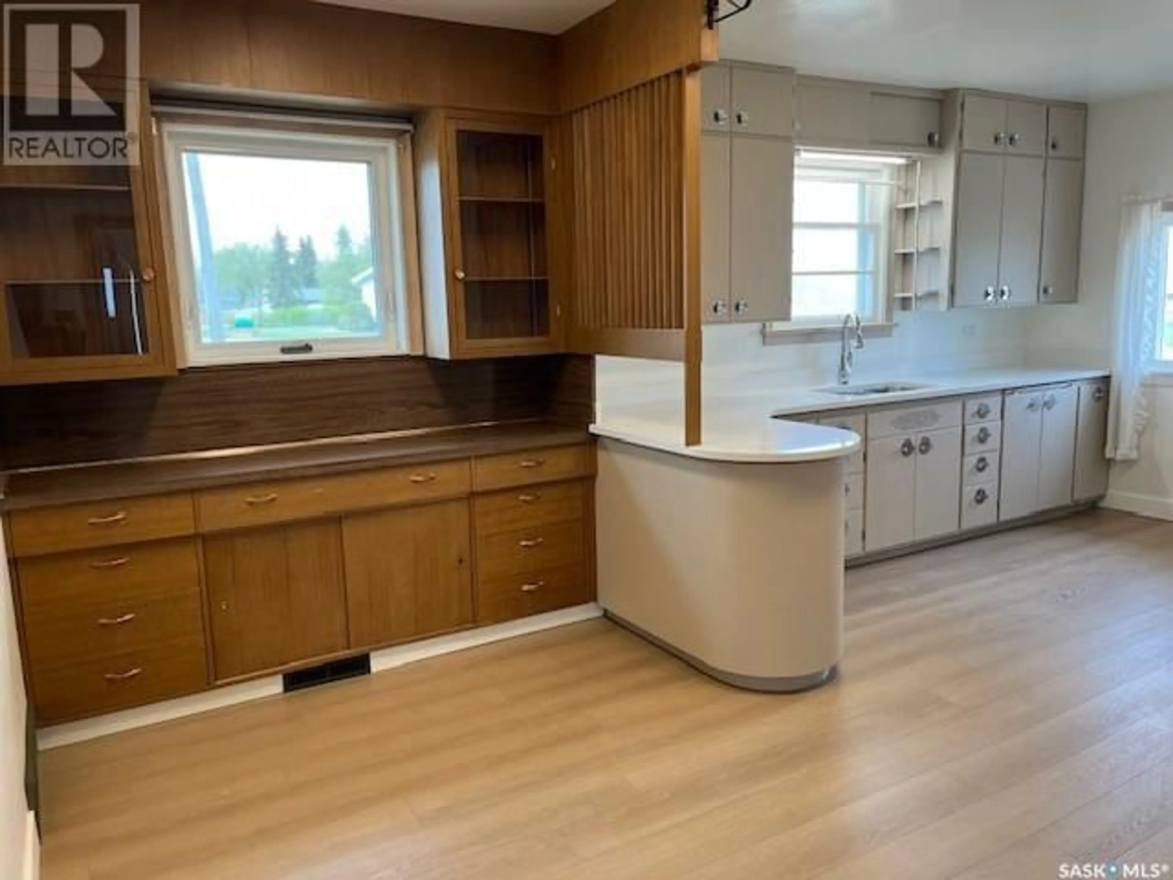 Open concept kitchen, wood/laminate floor for 405 BURNS AVENUE, Melfort Saskatchewan S0E1A0