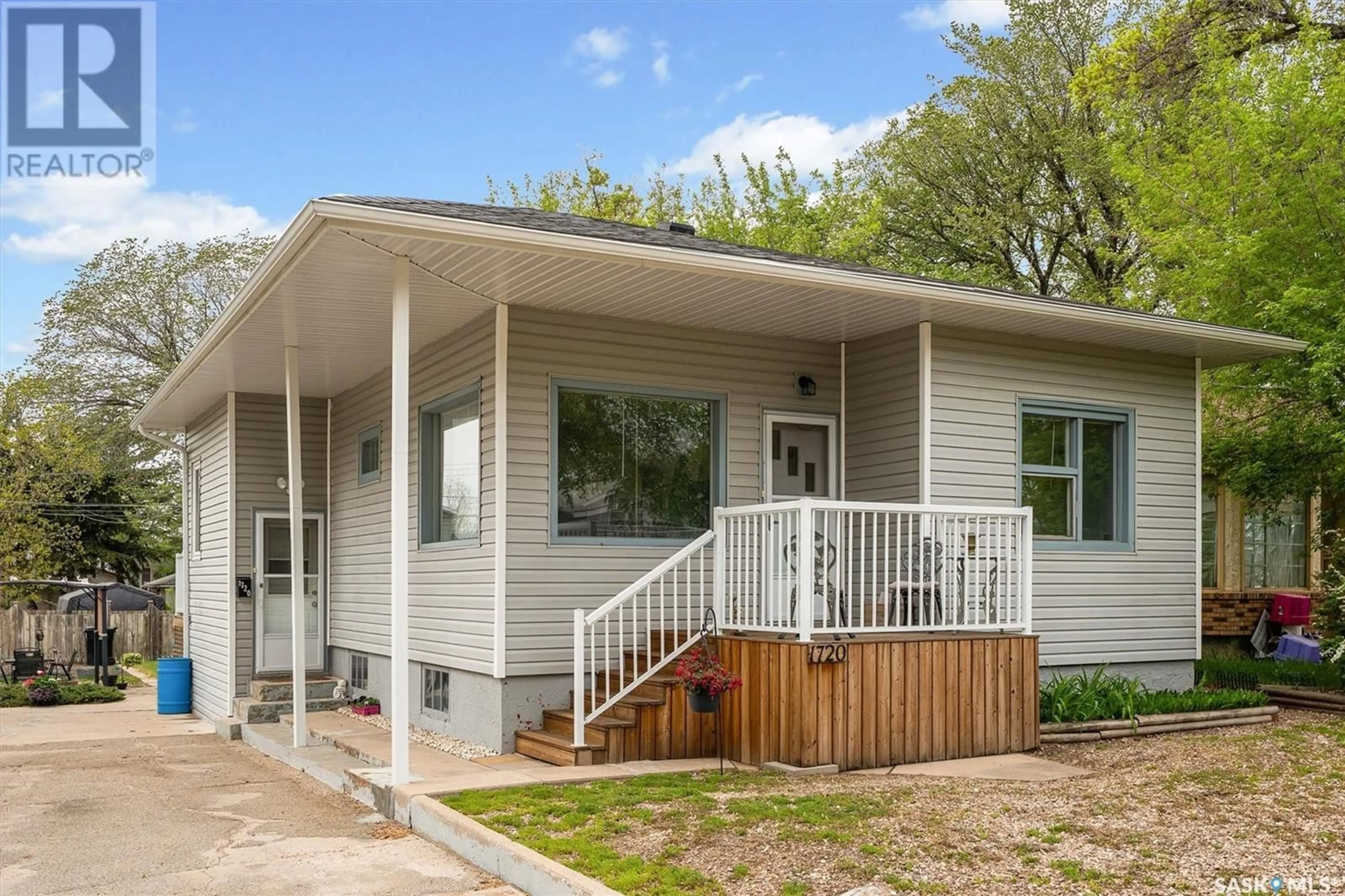 Home with vinyl exterior material, street for 1720 KILBURN AVENUE, Saskatoon Saskatchewan S7M0K3