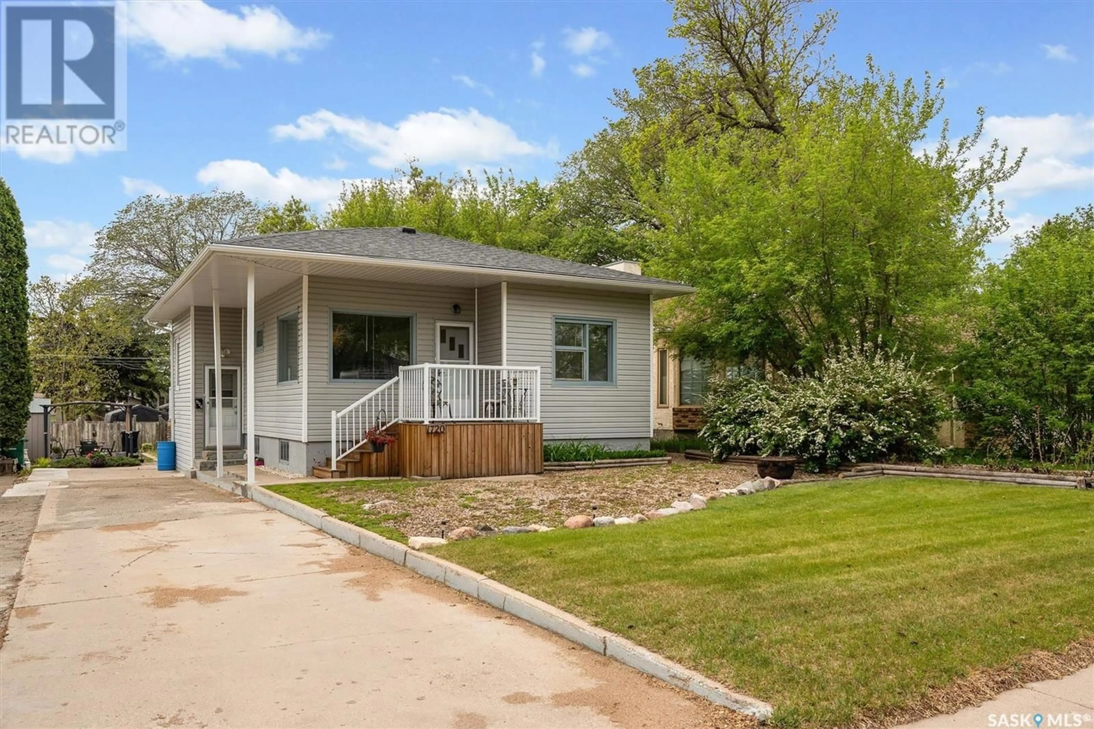 Home with vinyl exterior material, street for 1720 KILBURN AVENUE, Saskatoon Saskatchewan S7M0K3
