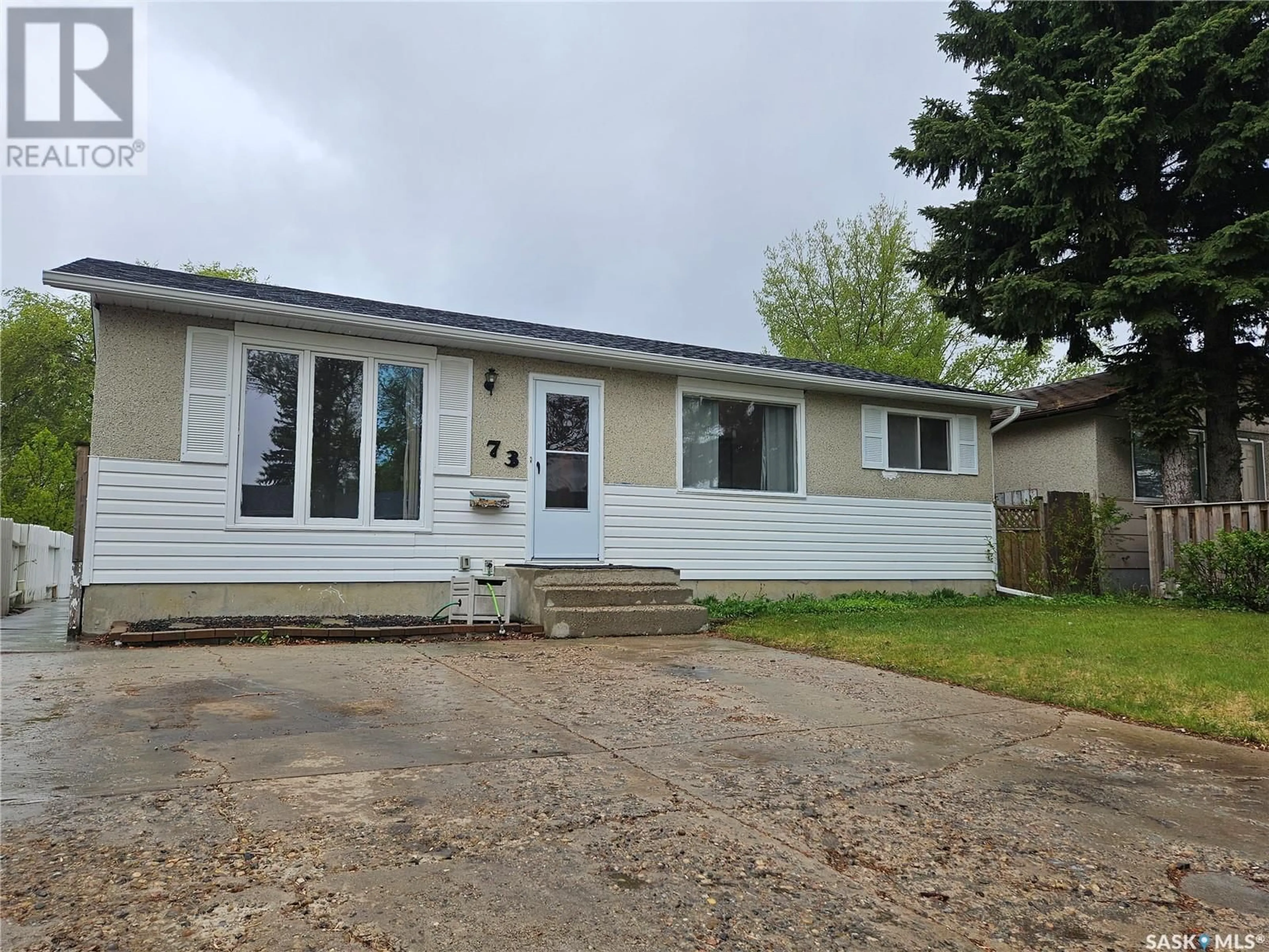 Home with vinyl exterior material, street for 73 CARTIER CRESCENT, Saskatoon Saskatchewan S7L4L8
