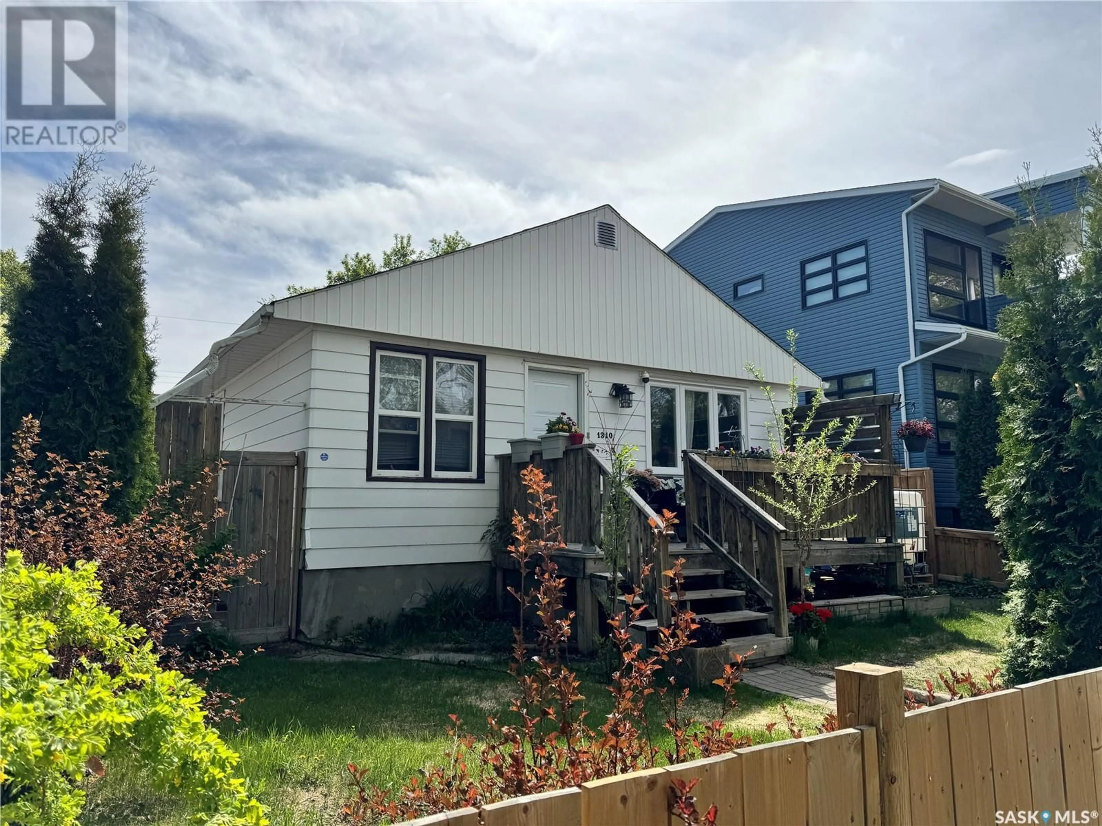 Home with vinyl exterior material, street for 1310 H AVENUE, Saskatoon Saskatchewan S7L2E4