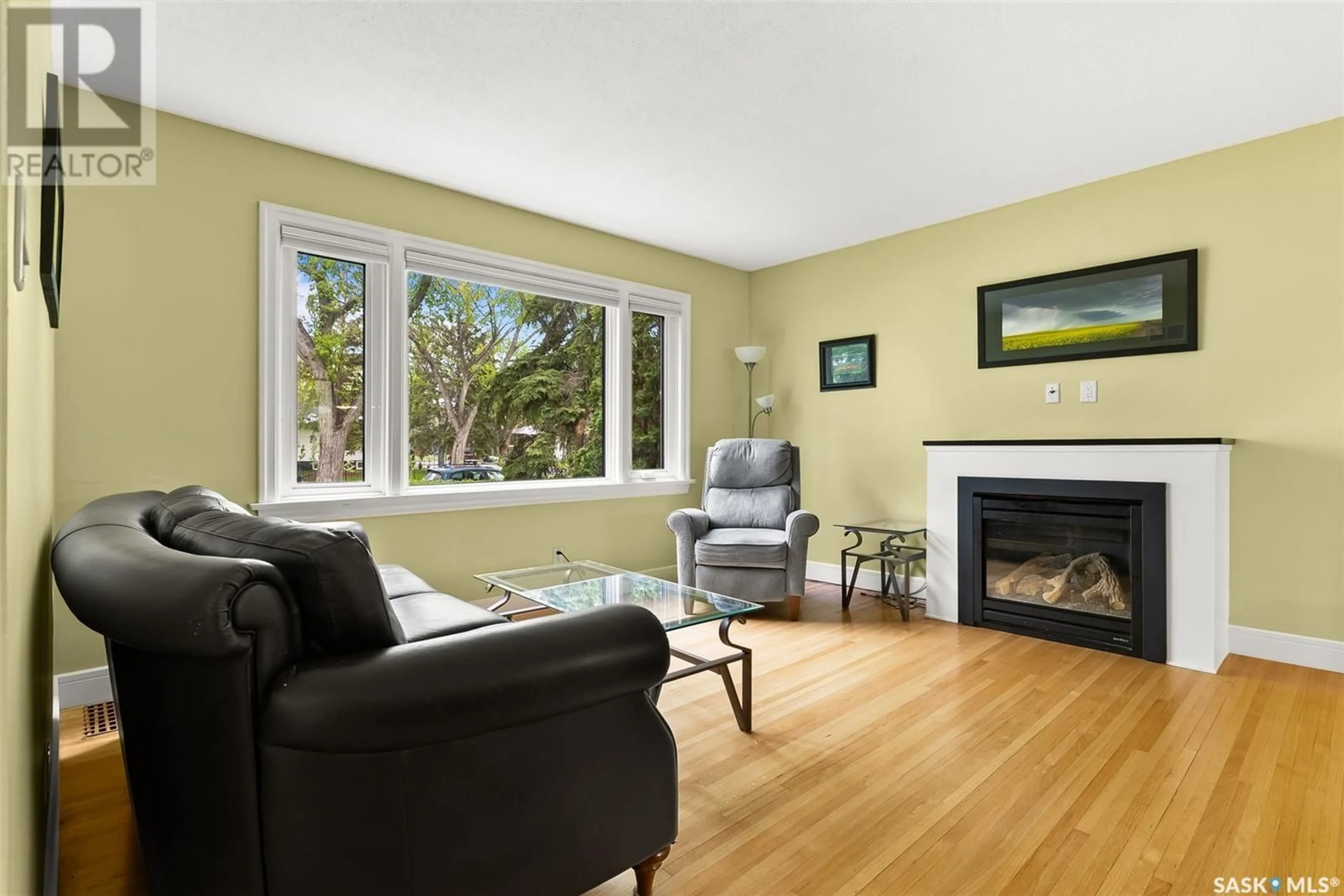 Living room with furniture, wood/laminate floor for 3311 HILL AVENUE, Regina Saskatchewan S4S0W8