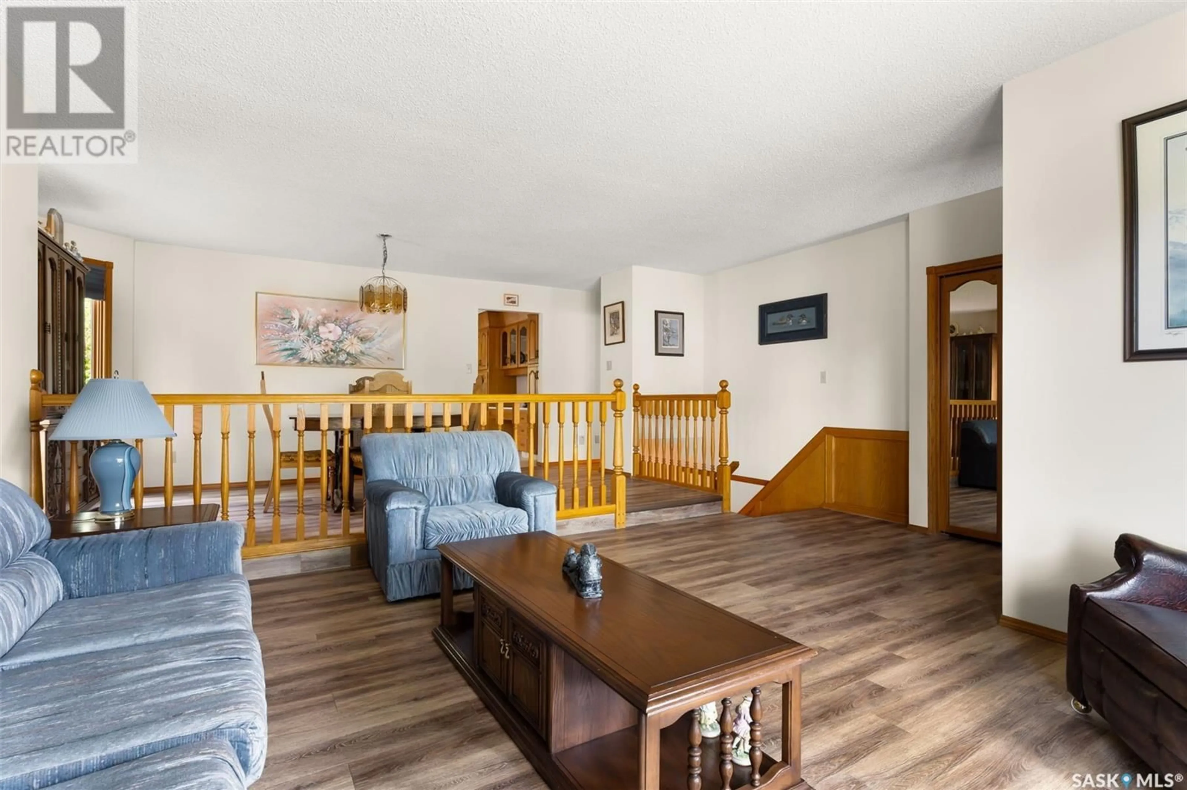Living room with furniture, wood/laminate floor for 2110 HANOVER CRESCENT, Regina Saskatchewan S4V0Z6