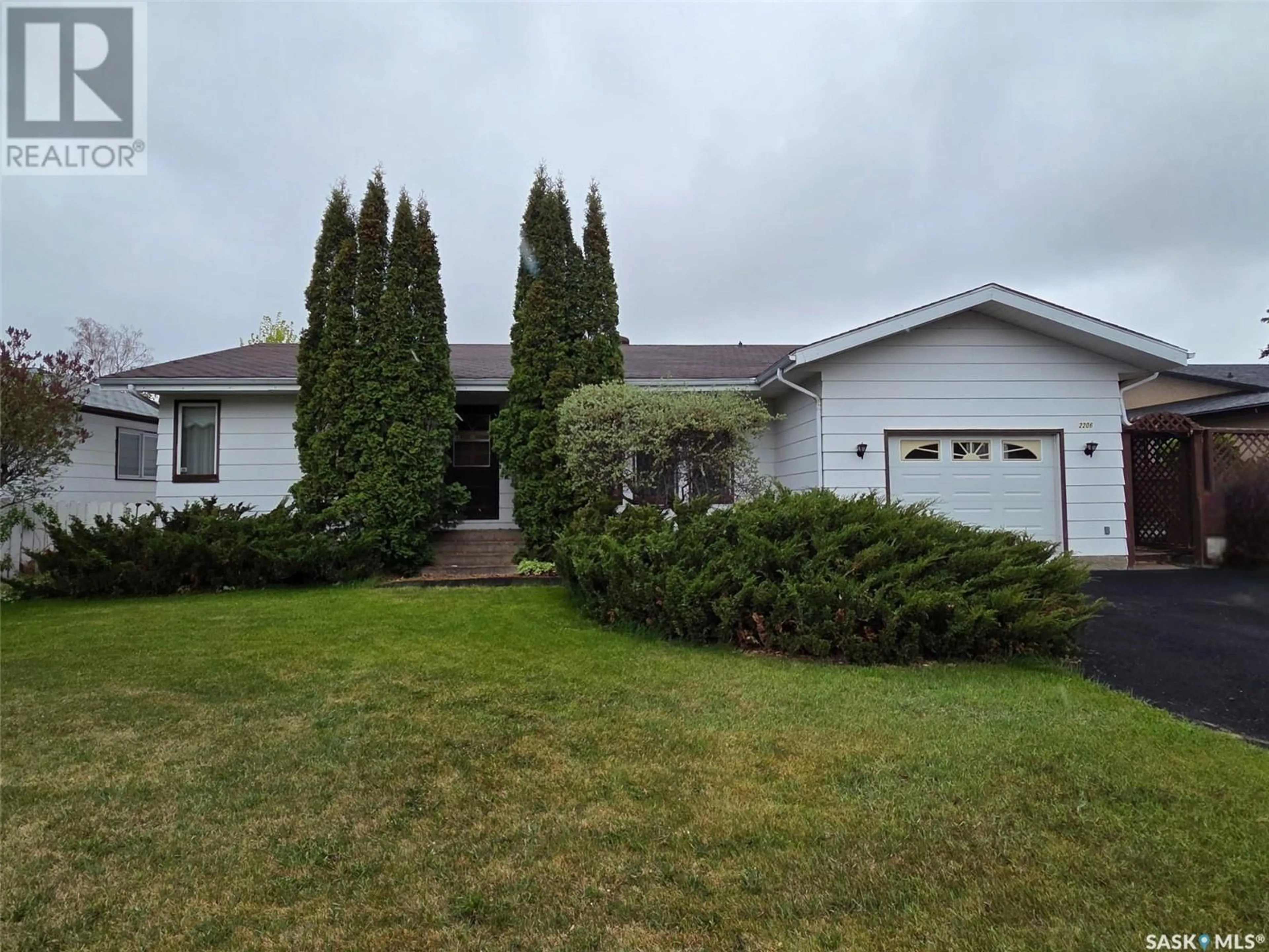 Home with vinyl exterior material, street for 2206 DOUGLAS AVENUE, North Battleford Saskatchewan S9A3M3