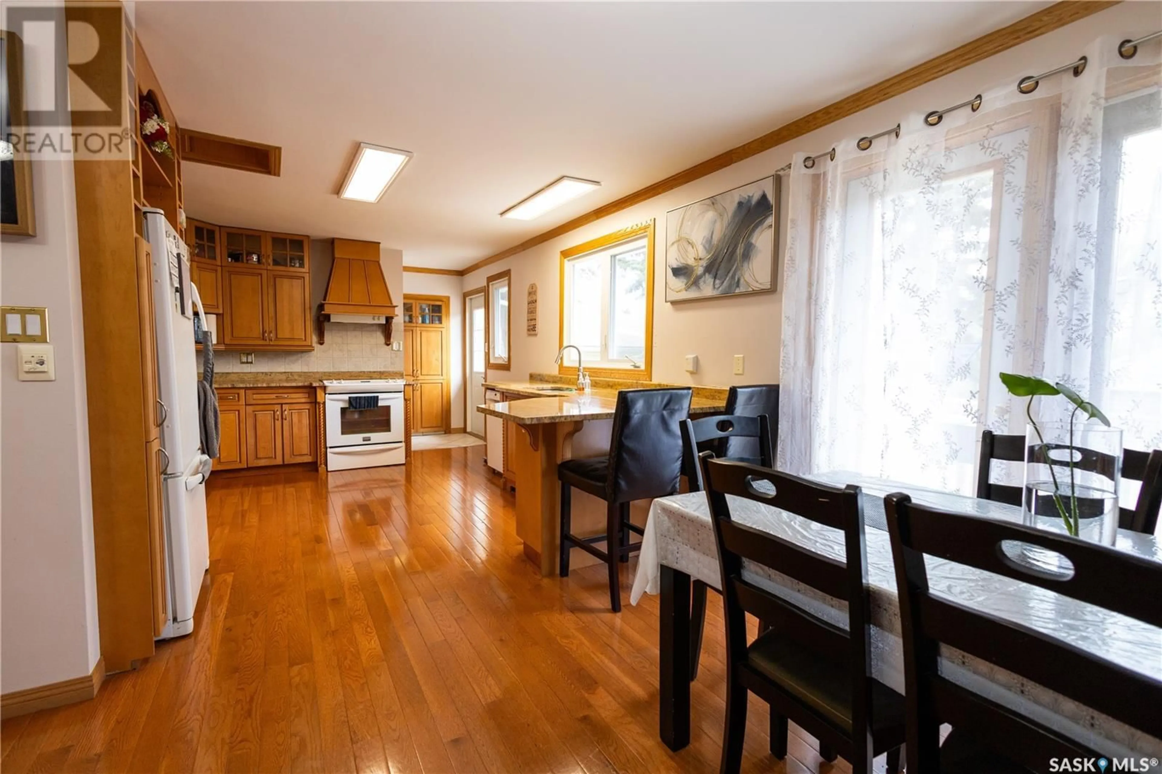 Dining room, wood/laminate floor for 710 CUELENAERE STREET, Prince Albert Saskatchewan S6V2S9