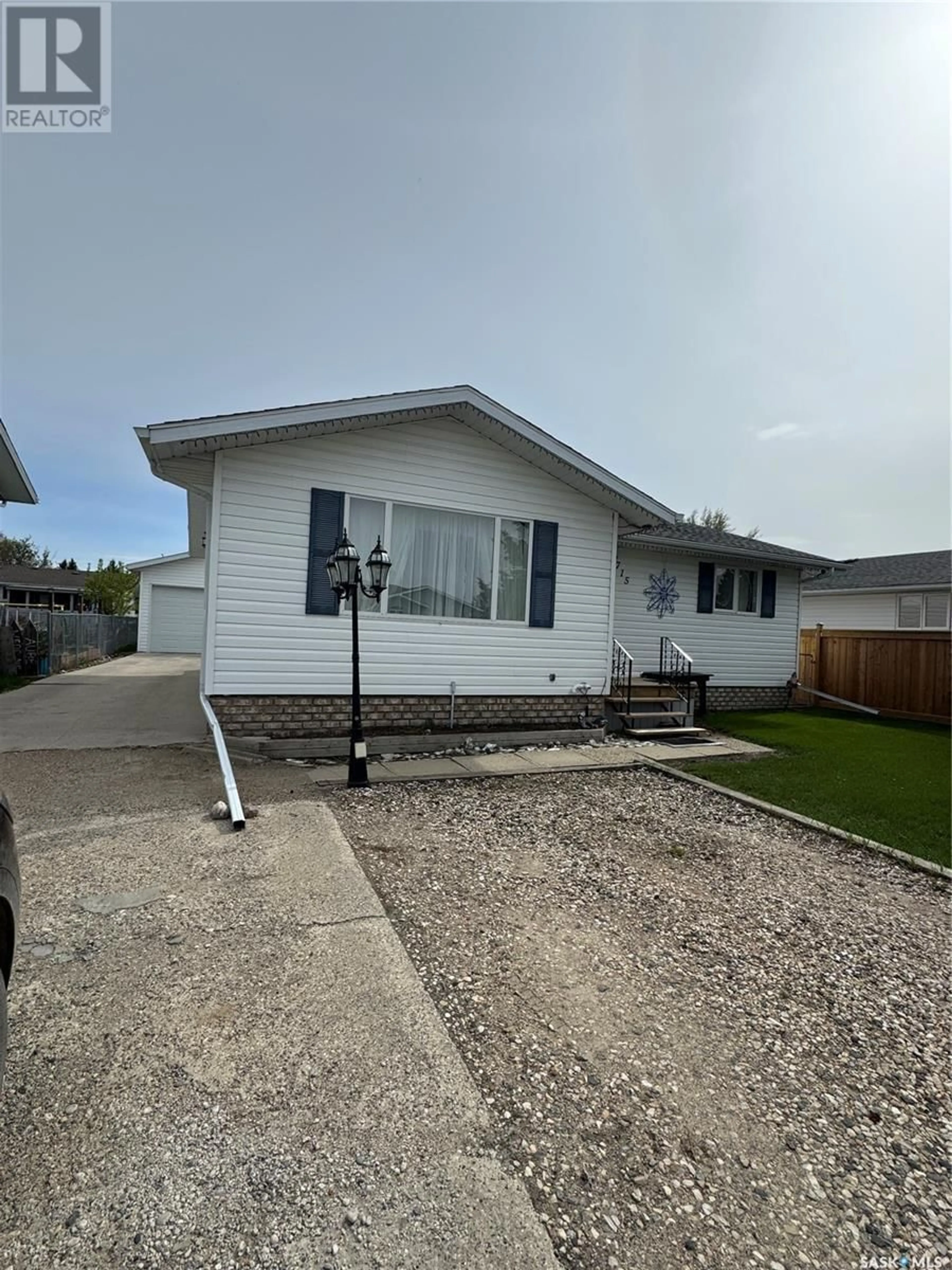 Home with vinyl exterior material, street for 715 6TH AVENUE, Hudson Bay Saskatchewan S0E0Y0
