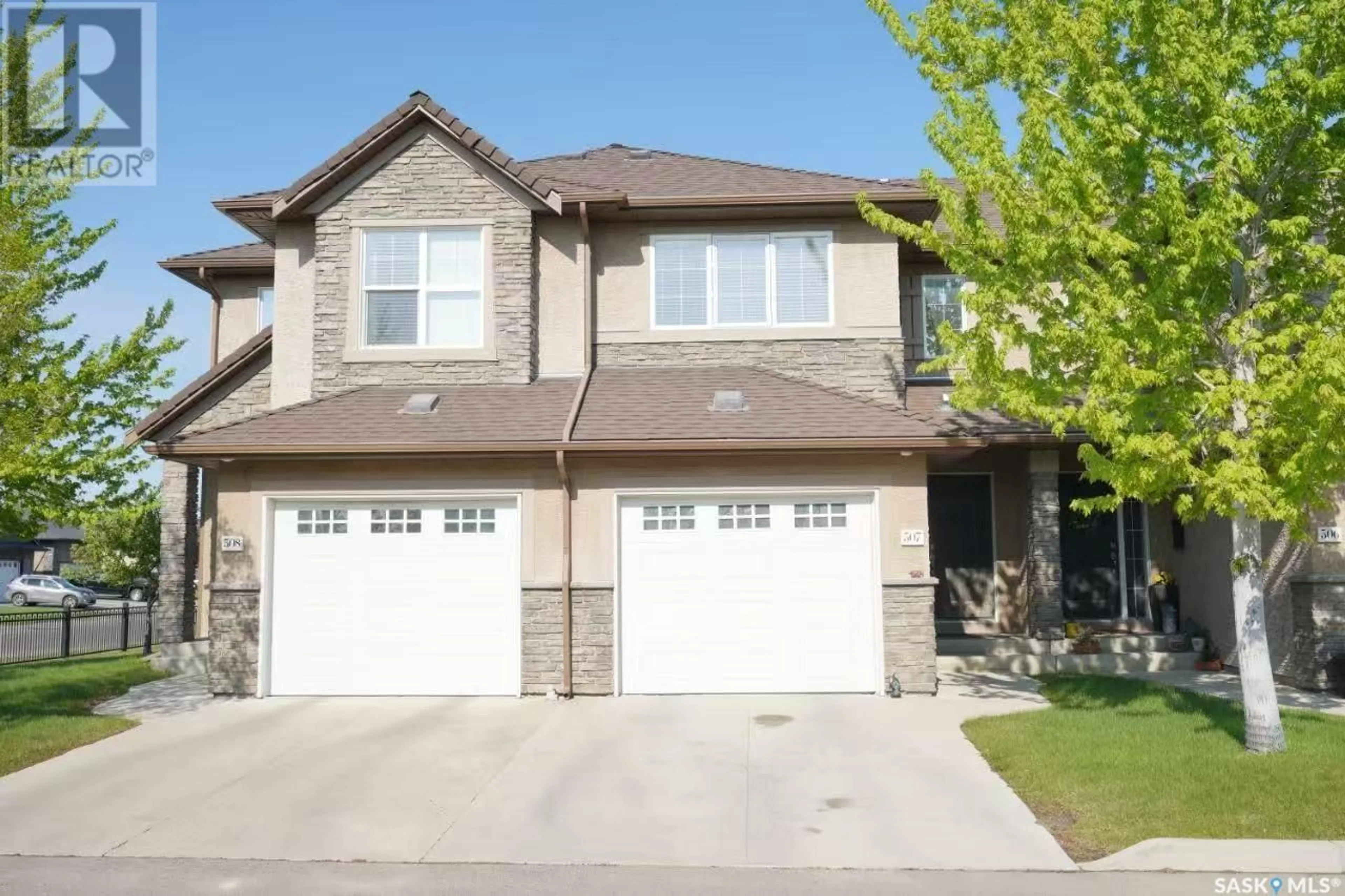 Home with vinyl exterior material, street for 307 - 710 GORDON ROAD, Saskatoon Saskatchewan S7T0J5