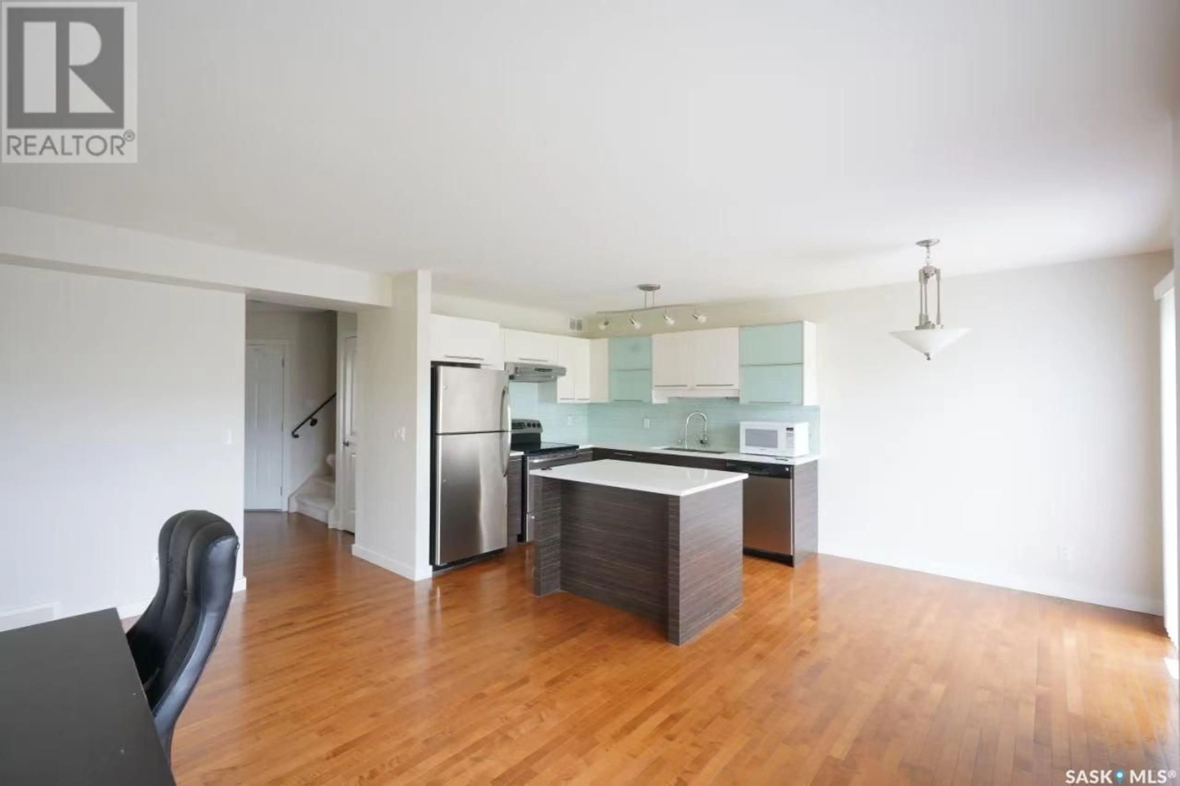 Open concept kitchen, wood/laminate floor for 307 - 710 GORDON ROAD, Saskatoon Saskatchewan S7T0J5