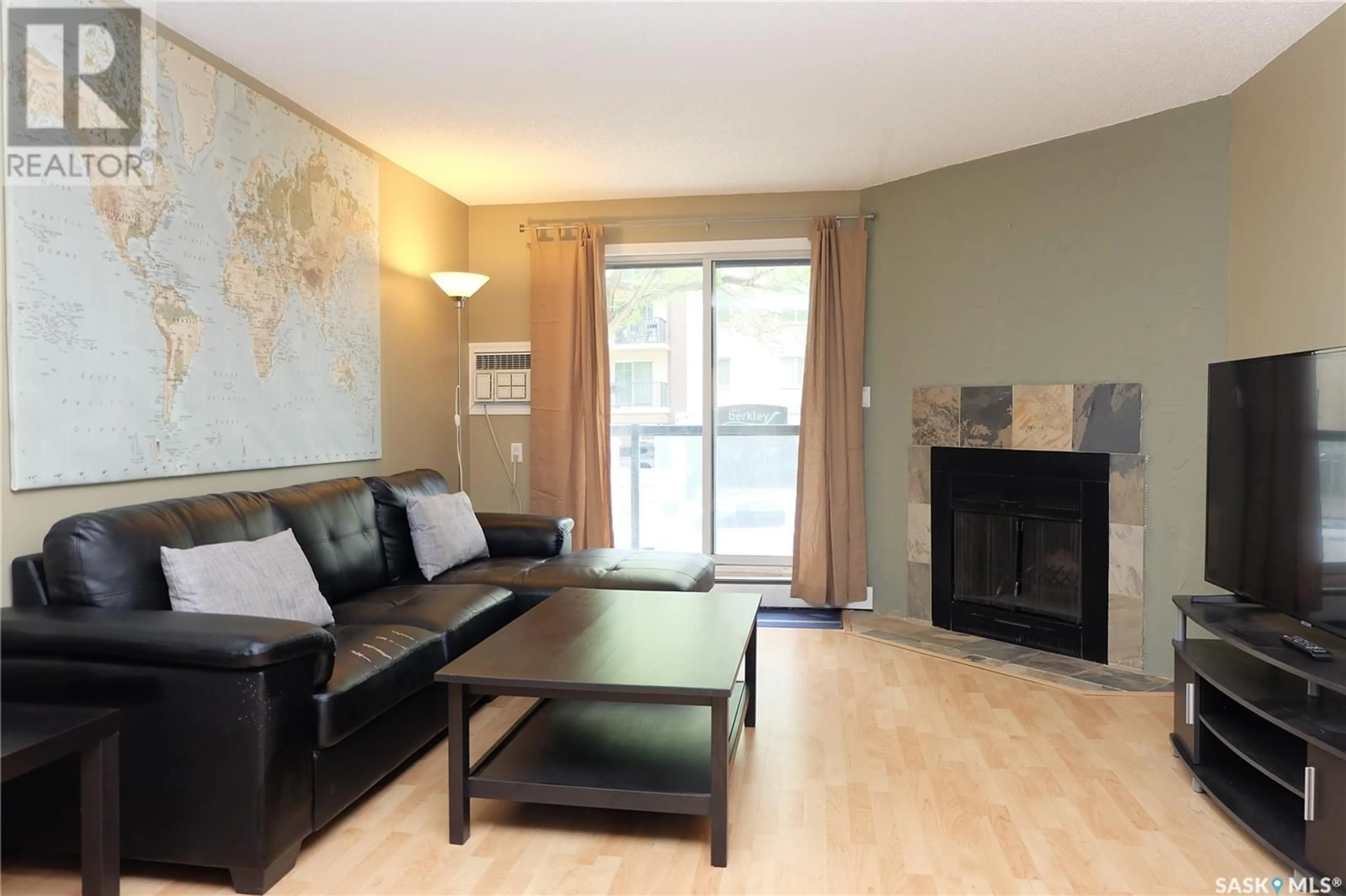 Living room with furniture, wood/laminate floor for 203 - 536 4TH AVENUE, Saskatoon Saskatchewan S7K2M7
