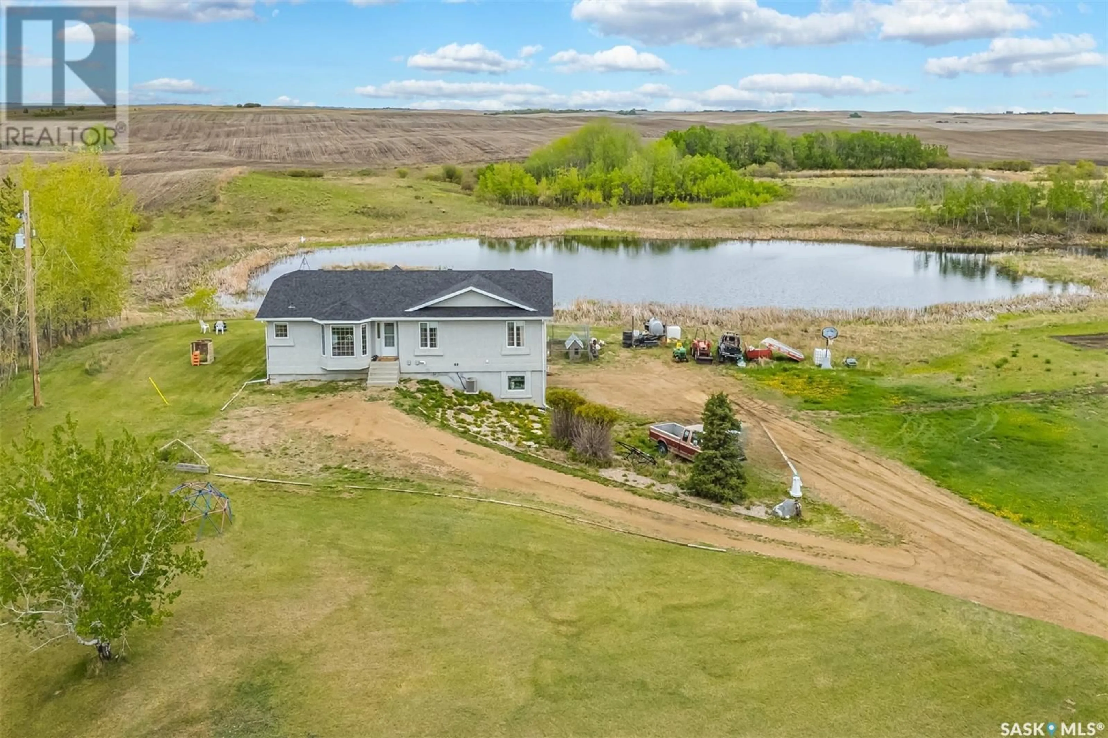A pic from outside/outdoor area/front of a property/back of a property/a pic from drone, water/lake/river/ocean view for POUND ACREAGE, Blucher Rm No. 343 Saskatchewan S0K3W0