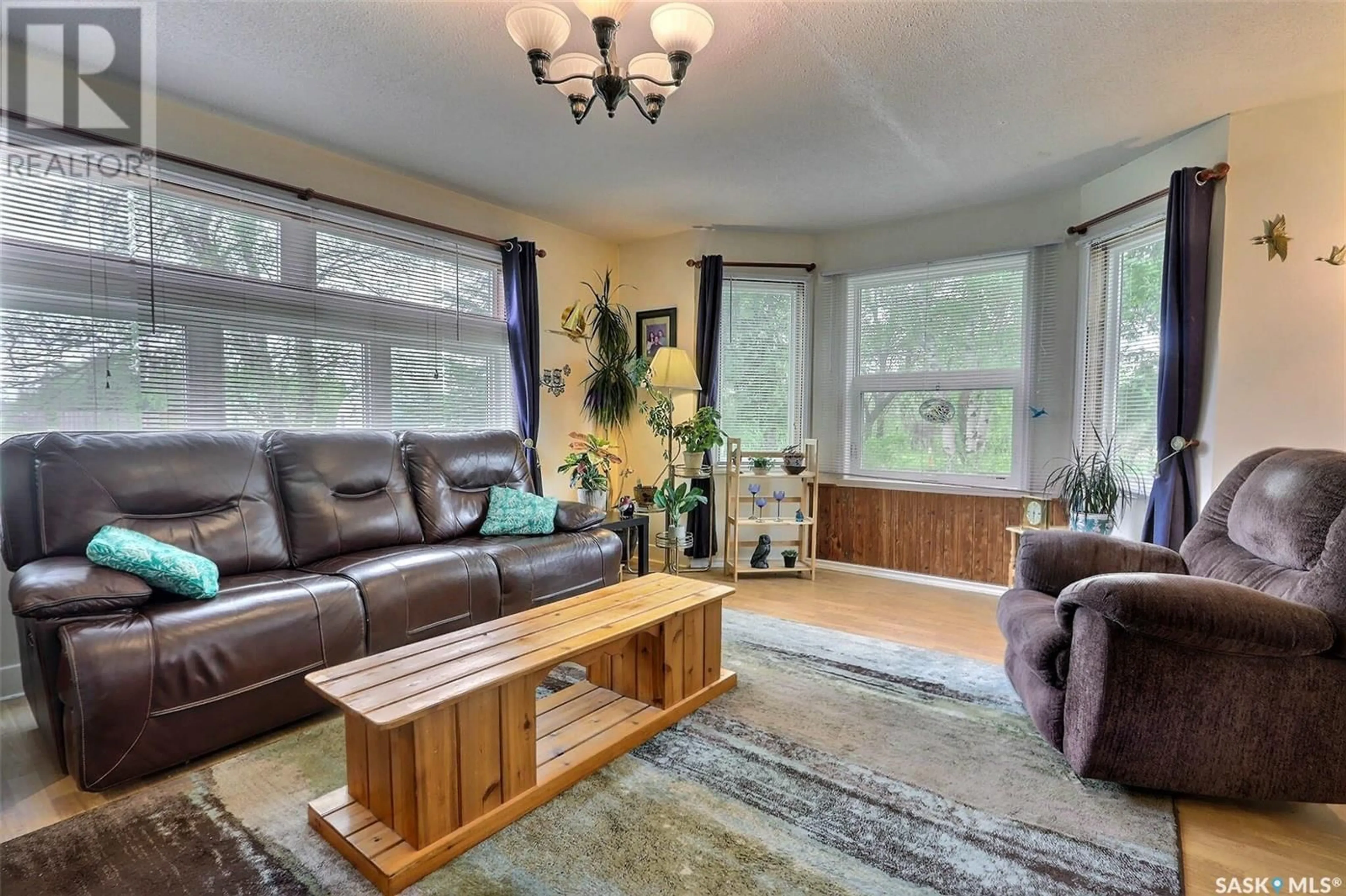 Living room with furniture, wood/laminate floor for 22 MAIN STREET, Crystal Springs Saskatchewan S0K1A0
