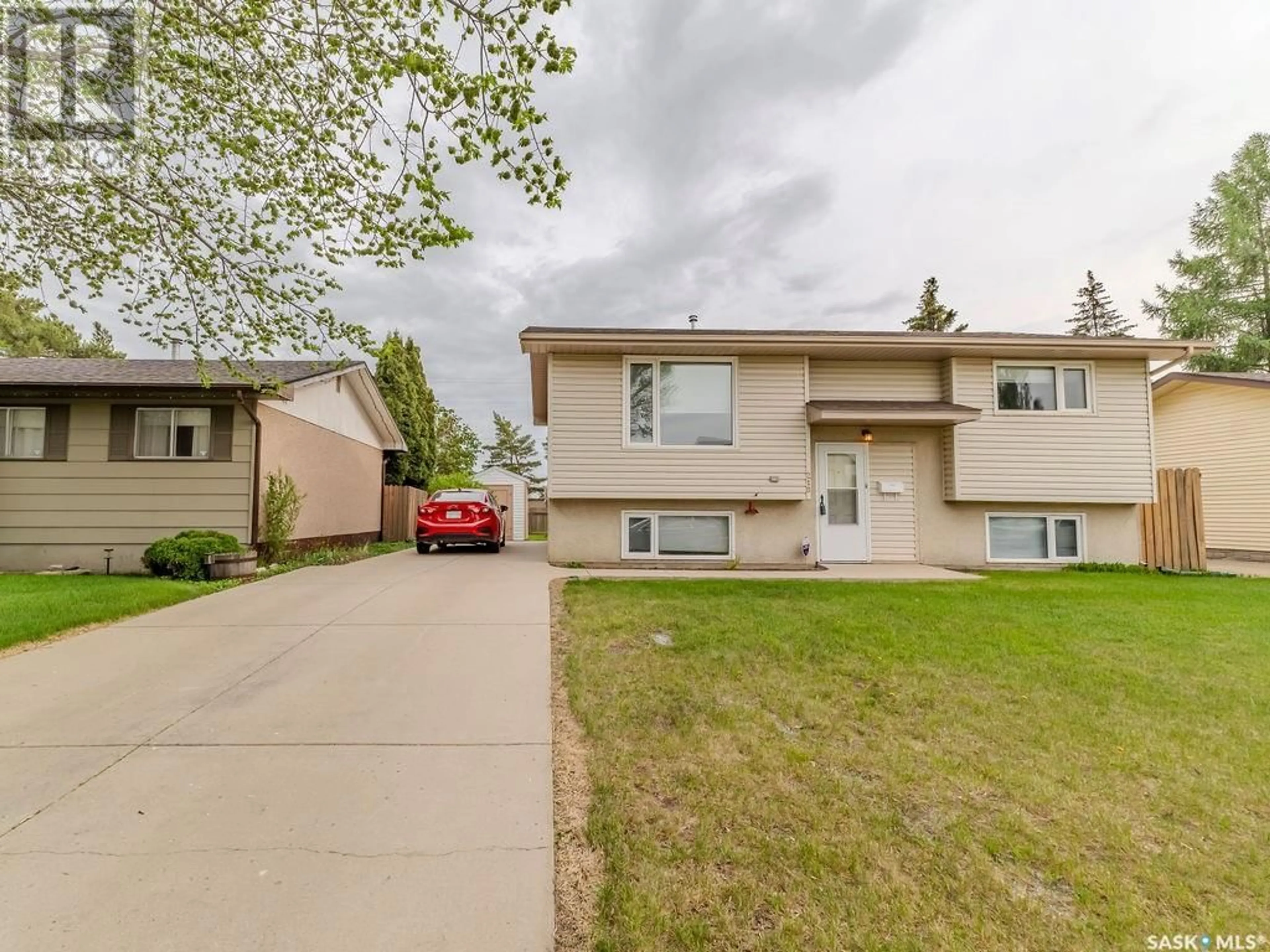 Home with vinyl exterior material, street for 218 TACHE CRESCENT, Saskatoon Saskatchewan S7L5G3