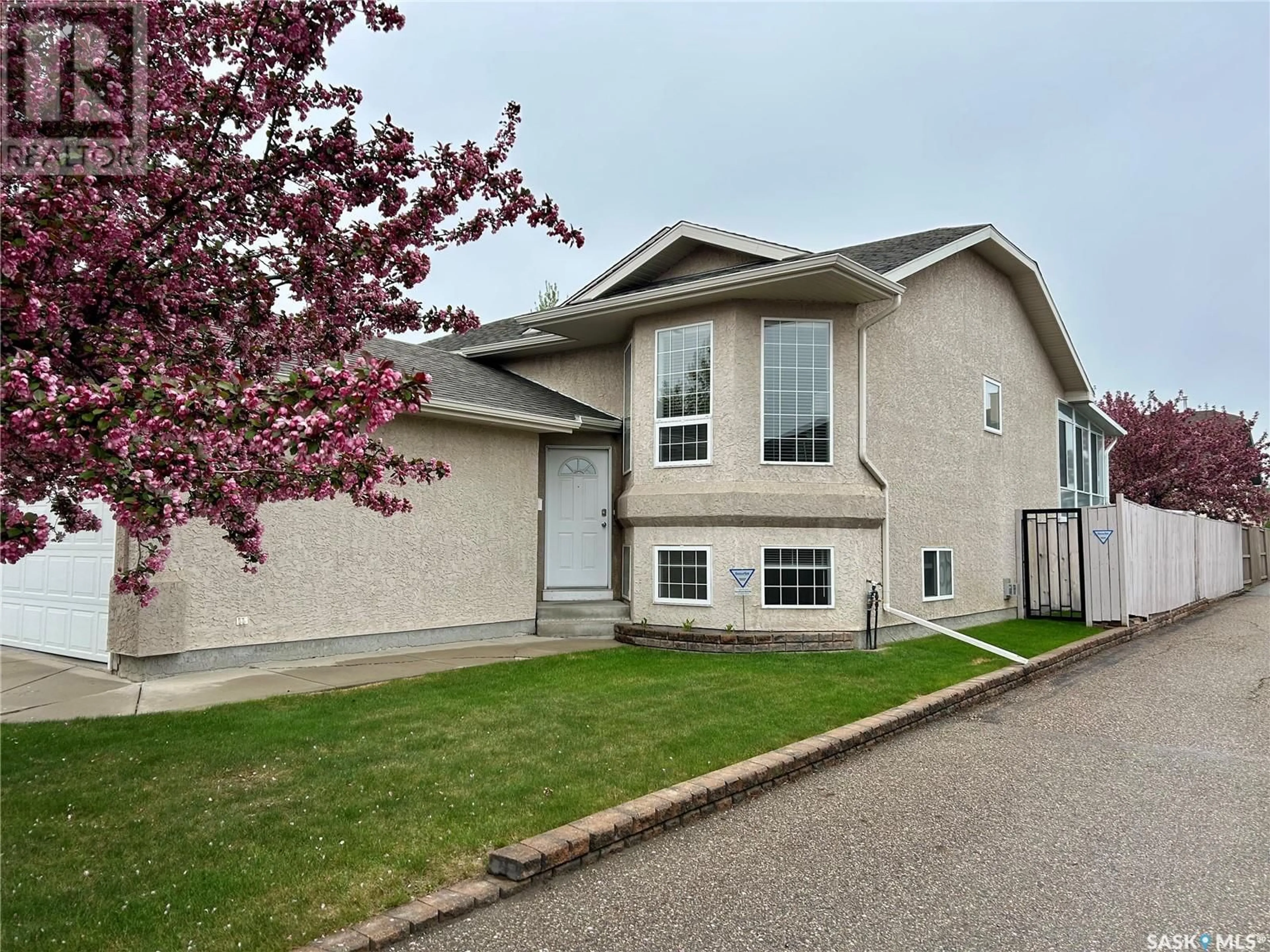 Home with vinyl exterior material, street for 214 PETERS COVE, Saskatoon Saskatchewan S7N4T4