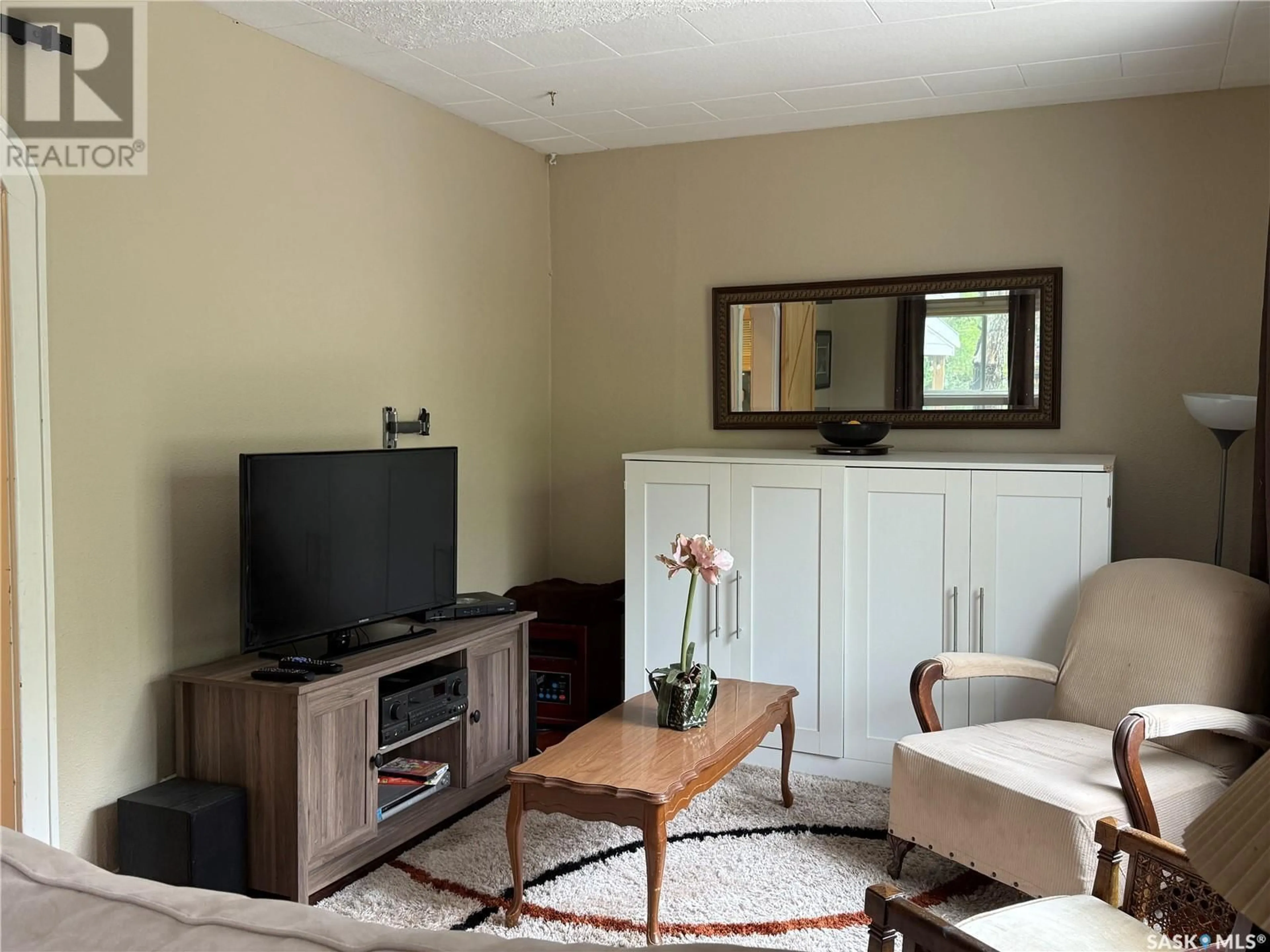 Living room with furniture, wood/laminate floor for 106 METROPOLITAN DRIVE, South Lake Saskatchewan S6H7W6