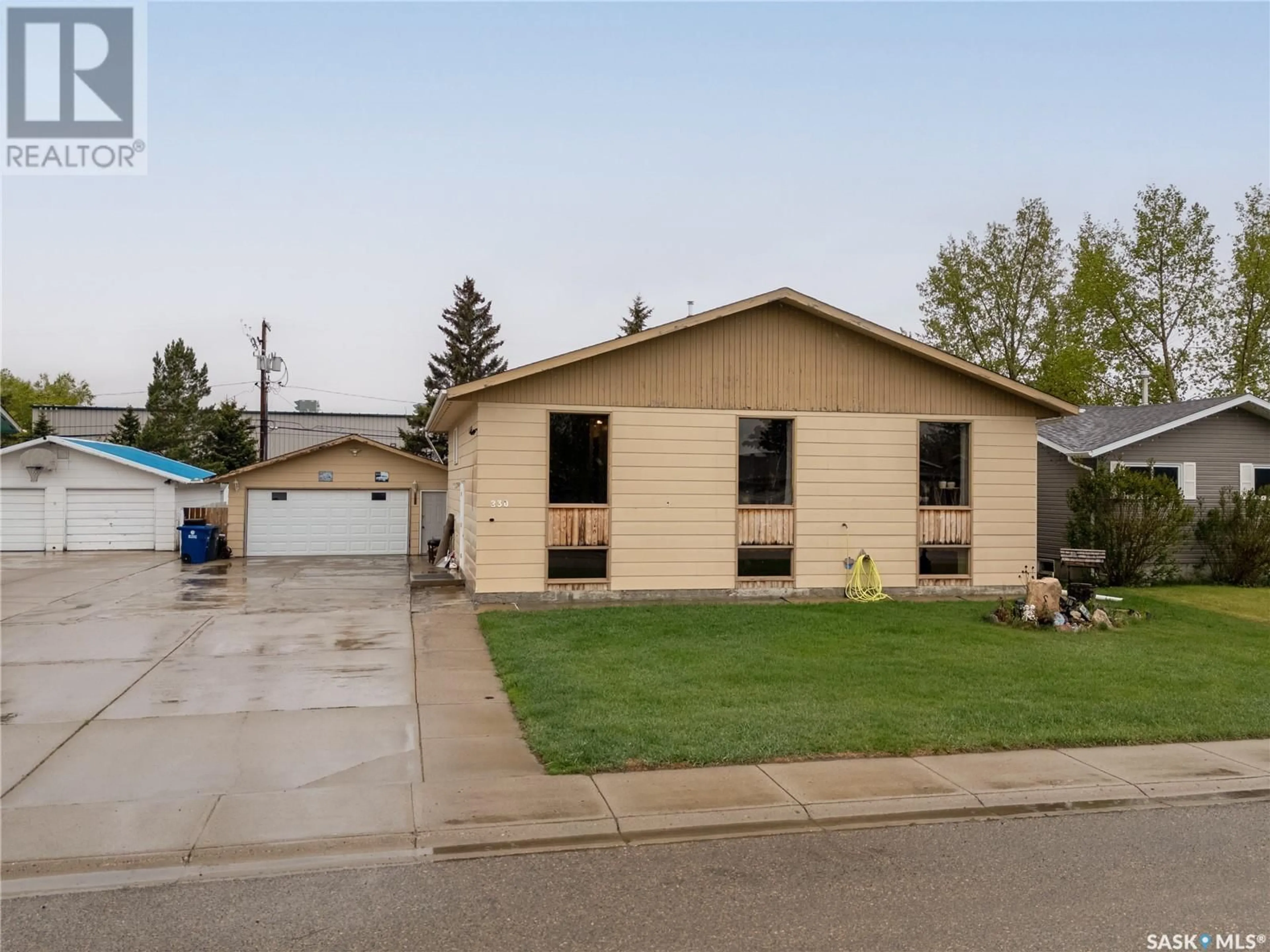 Home with vinyl exterior material, street for 230 1ST AVENUE, Martensville Saskatchewan S0K2T0